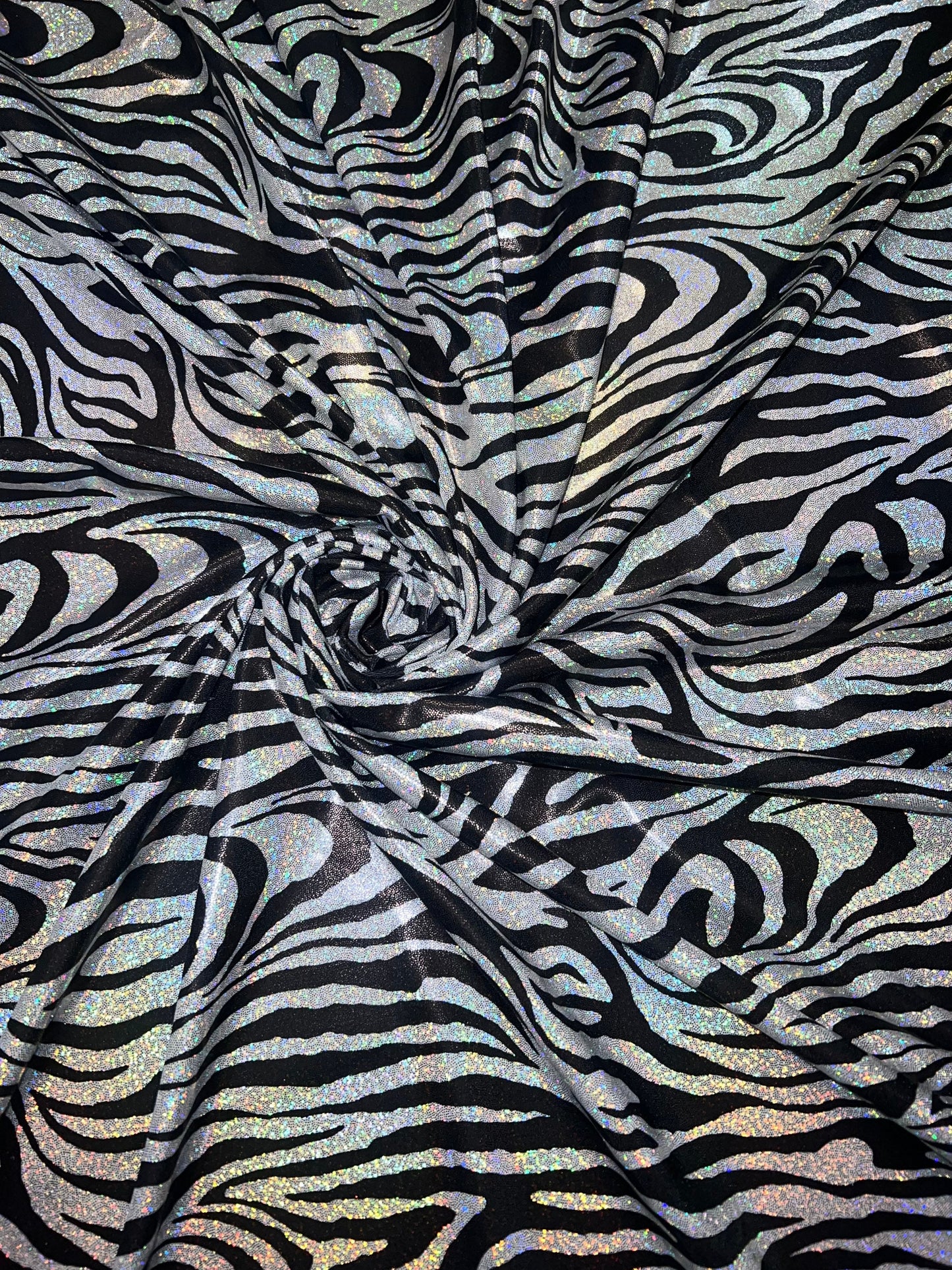 New Holographic zebra design print on metallic nylon spandex 4-Way stretch 58/60”Sold by the YD.Ships worldwide from Los Angeles CA.