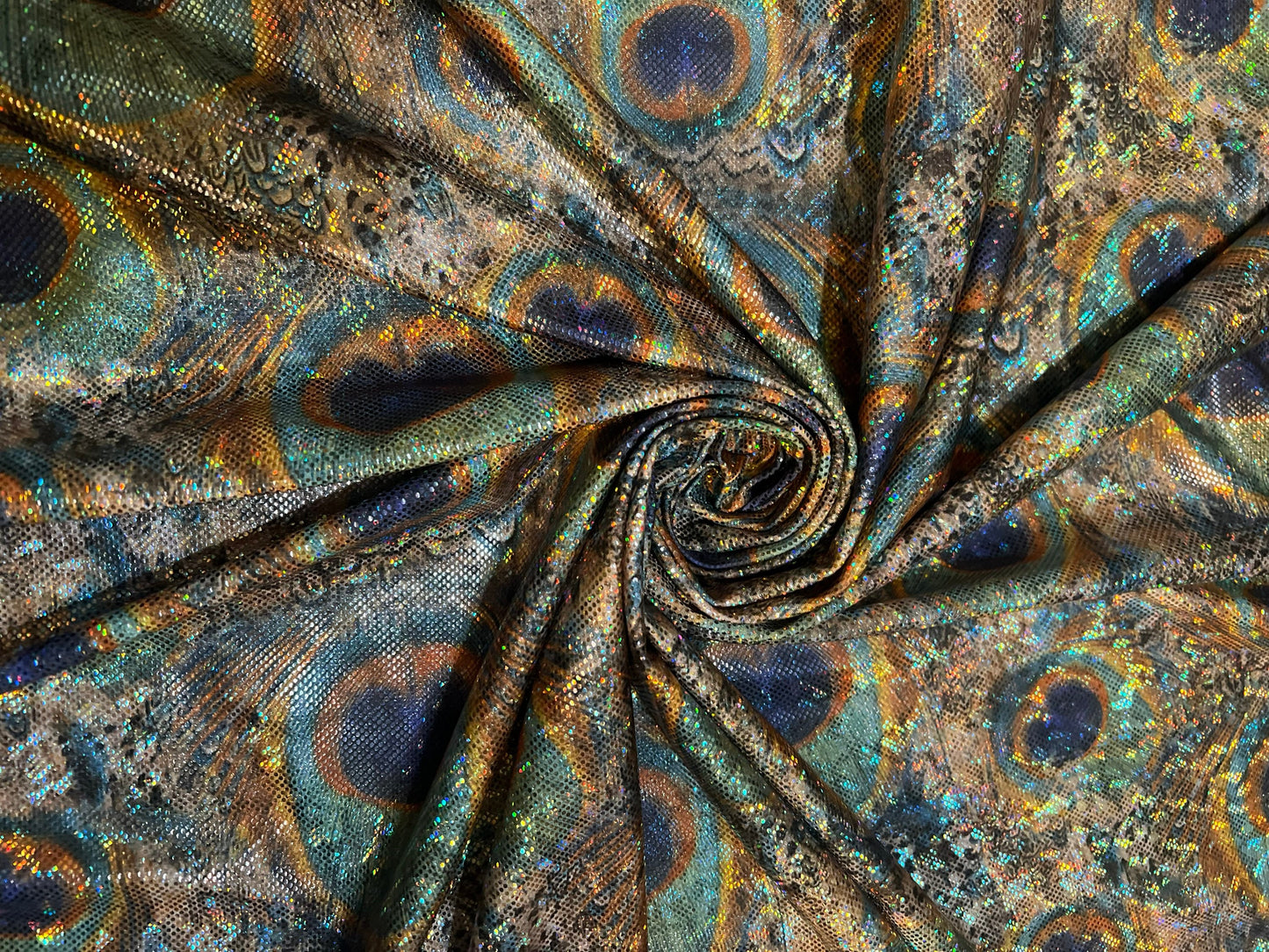 New Hologram metallic peacock  design print on the best quality of nylon spandex4way Stretch 58/60” Sold by the YD.Ships worldwide from LA.