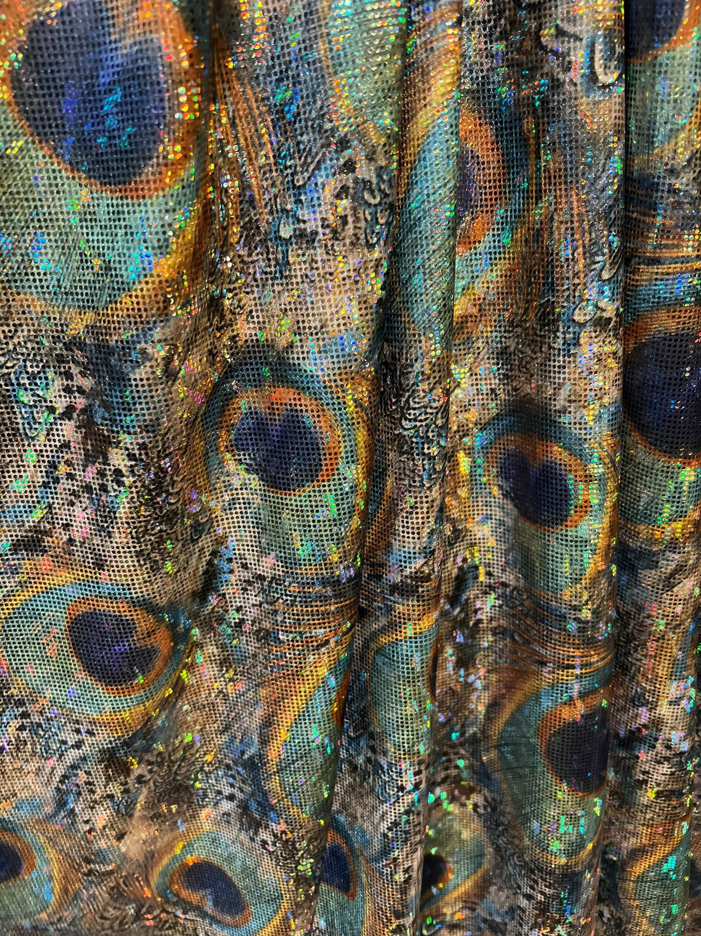 New Hologram metallic peacock  design print on the best quality of nylon spandex4way Stretch 58/60” Sold by the YD.Ships worldwide from LA.