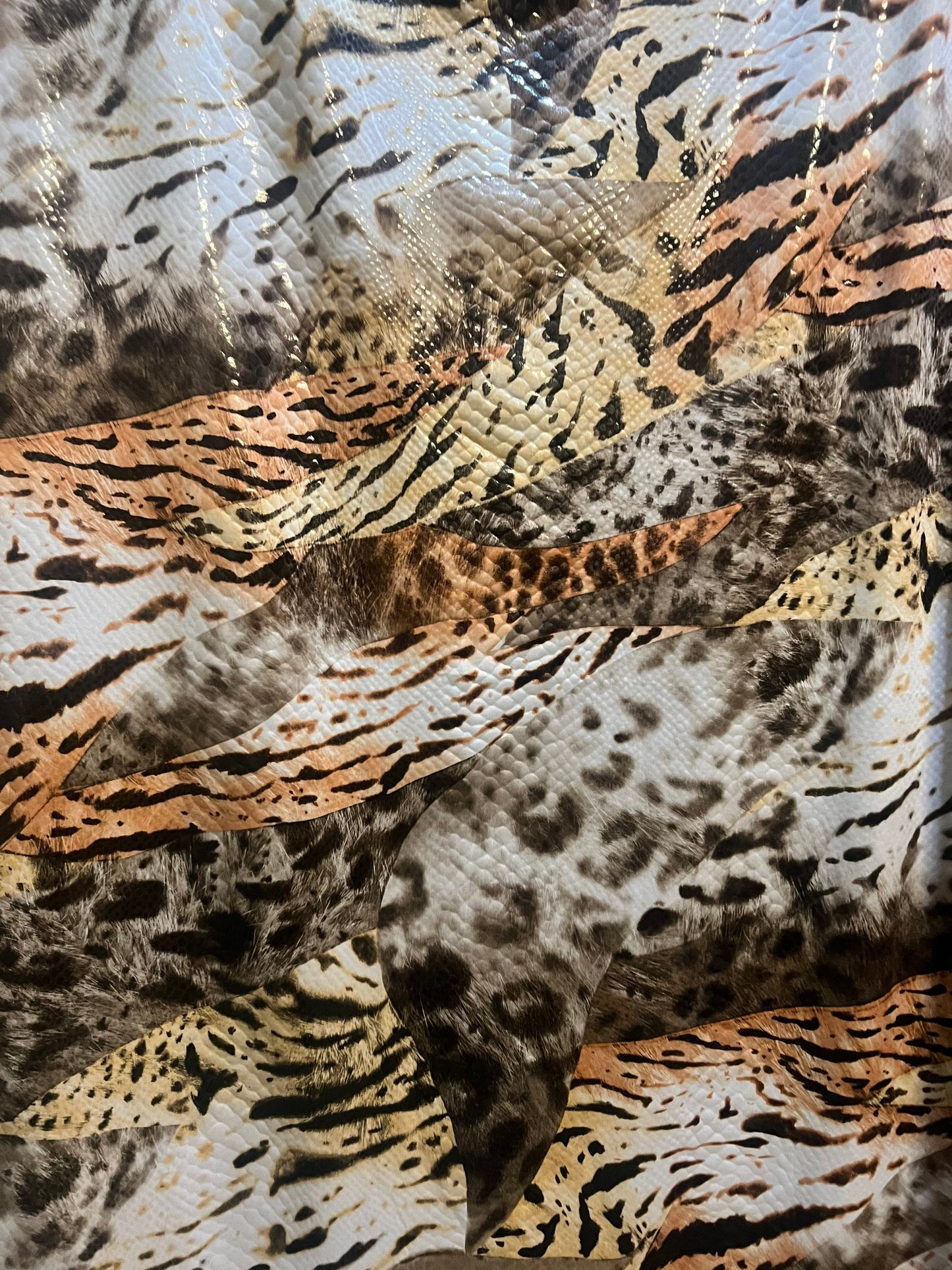 Safari animal design print on poly spandex with clear foil 2-way Stretch 58/60”Sold by the YD.Ships worldwide from Los Angeles California