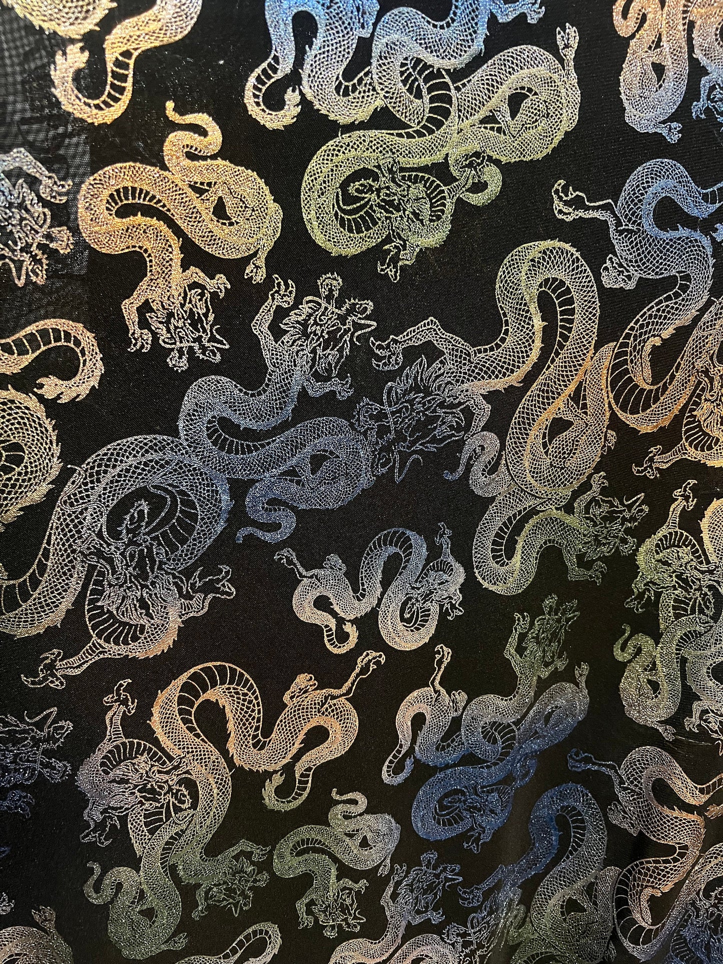 New Tie dye dragons design print on power mesh nylon spandex with metallic 4-way stretch 58/60”Sold by the YD.Ships worldwide from LA.