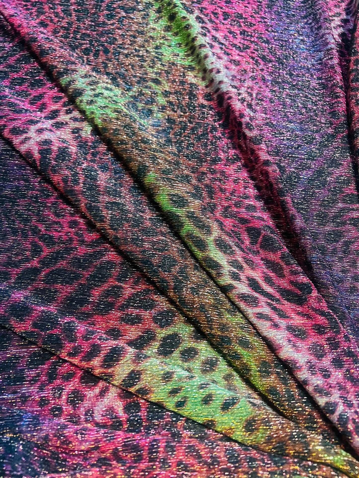 Leopard tie dye design print on pleated metallic mesh 4-way stretch 58/60”Sold by the YD.Ships worldwide from Los Angeles California USA