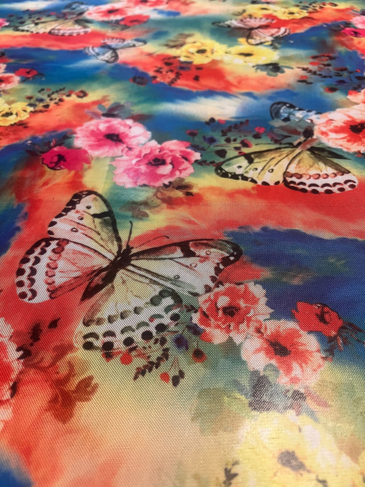 Flowers and butterfly design print on power mesh 4-way stretch 50/60”Sold by the YD.Ships worldwide from Los Angeles California USA.