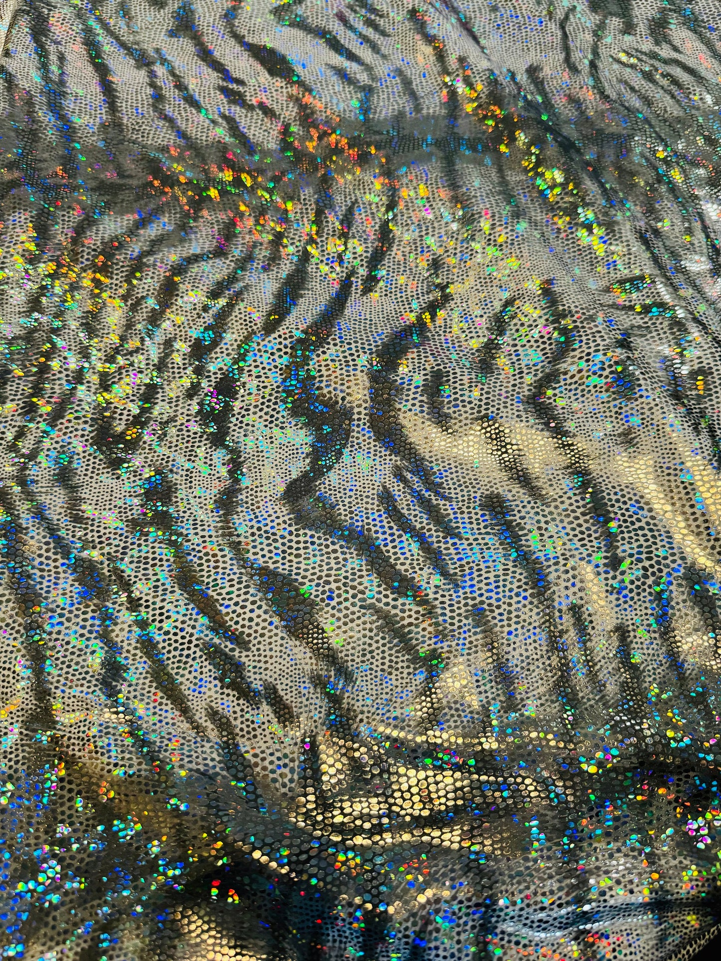 New modern tiger design hologram metallic nylon spandex 4-way stretch 58/60”Sold by the YD.Ships worldwide from Los Angeles California USA.