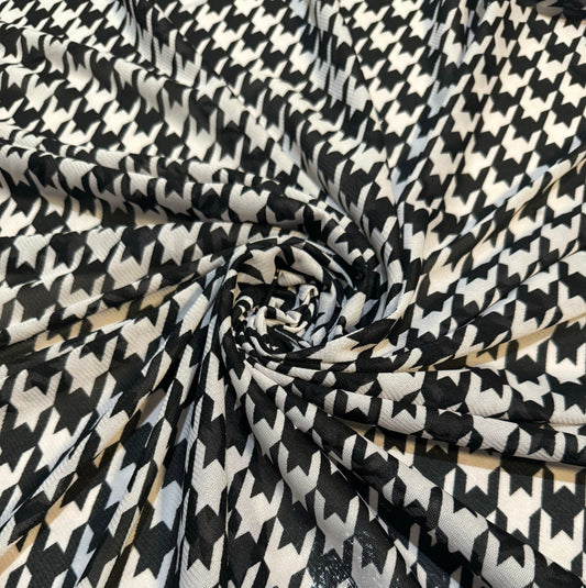 New houndstooth design print on power mesh nylon spandex 4way stretch 58/60”sold by the YD. Ships worldwide from Los Angeles California USA.