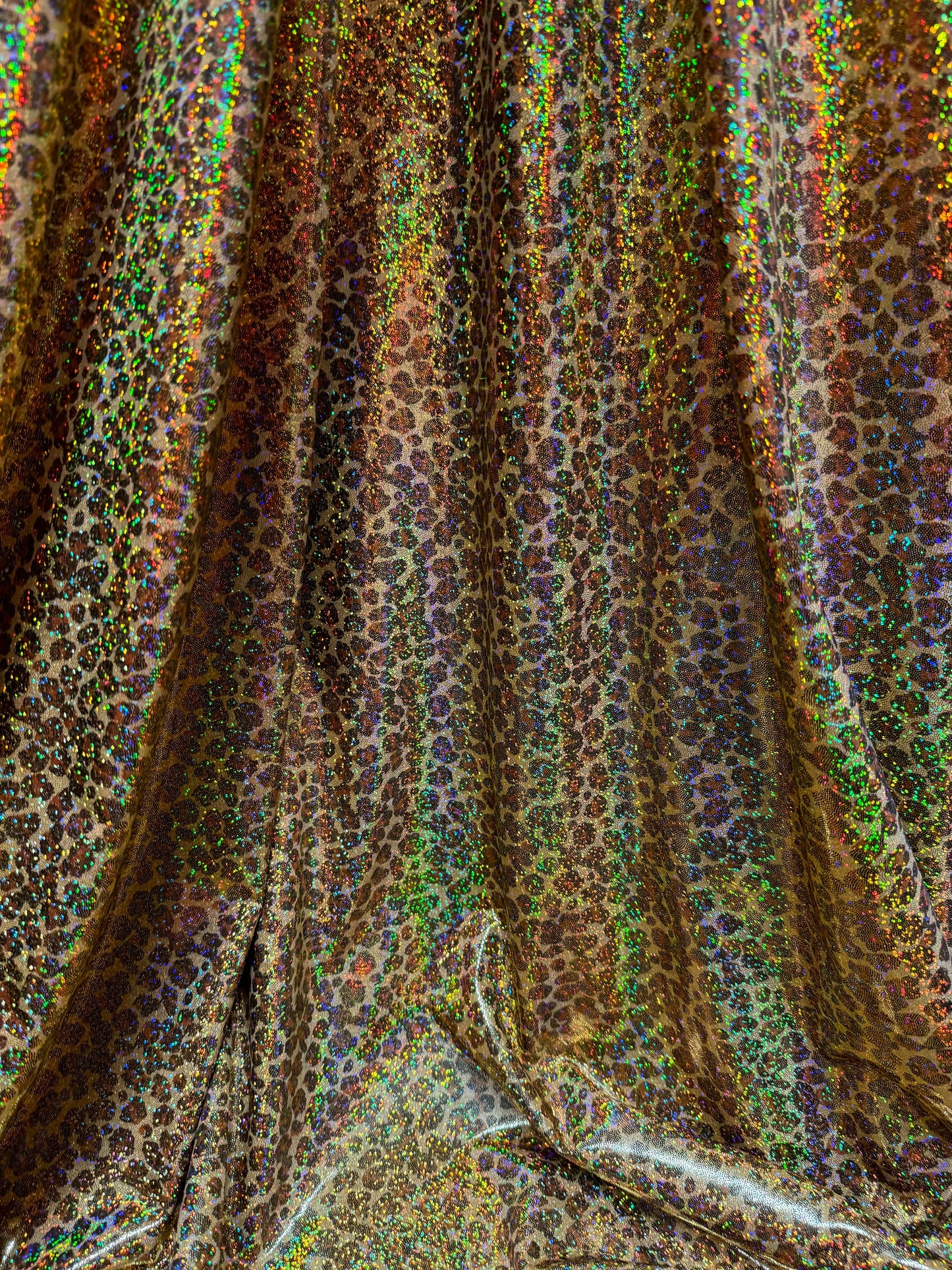New Cheetah leopard print on hologram metallic nylon spandex 4way stretch 58/60”sold by the YD.Ships worldwide from Los Angeles California.