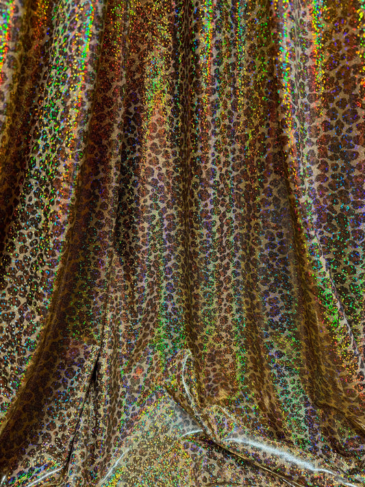New Cheetah leopard print on hologram metallic nylon spandex 4way stretch 58/60”sold by the YD.Ships worldwide from Los Angeles California.