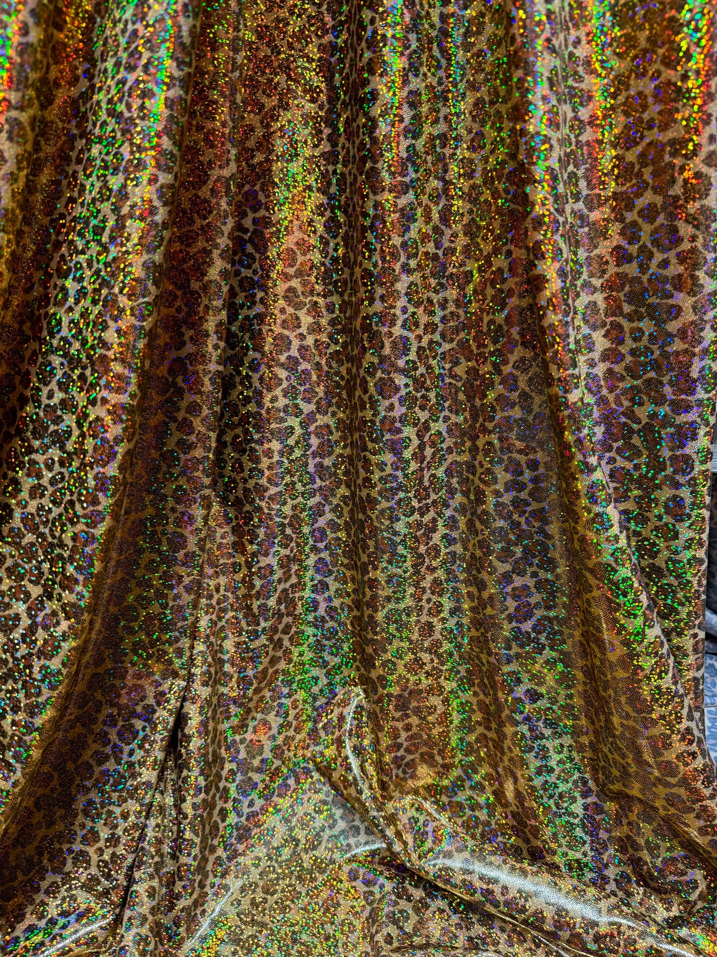 New Cheetah leopard print on hologram metallic nylon spandex 4way stretch 58/60”sold by the YD.Ships worldwide from Los Angeles California.