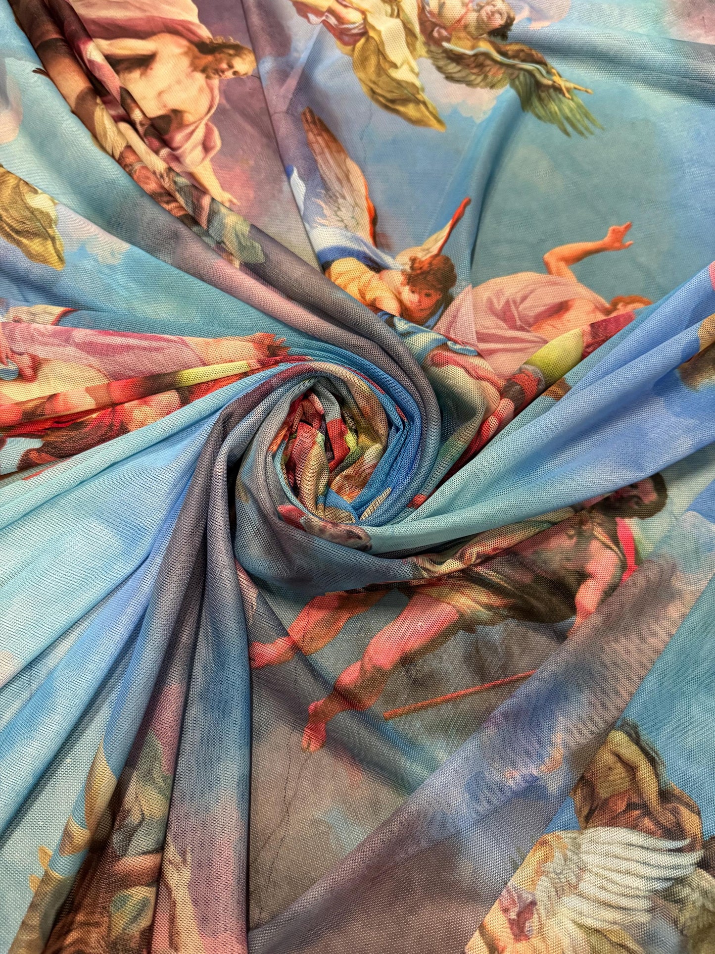 New angels and clouds design print on power mesh nylon spandex4-stretch 58/60”sold by the YD.Ships worldwide from Los Angeles California.