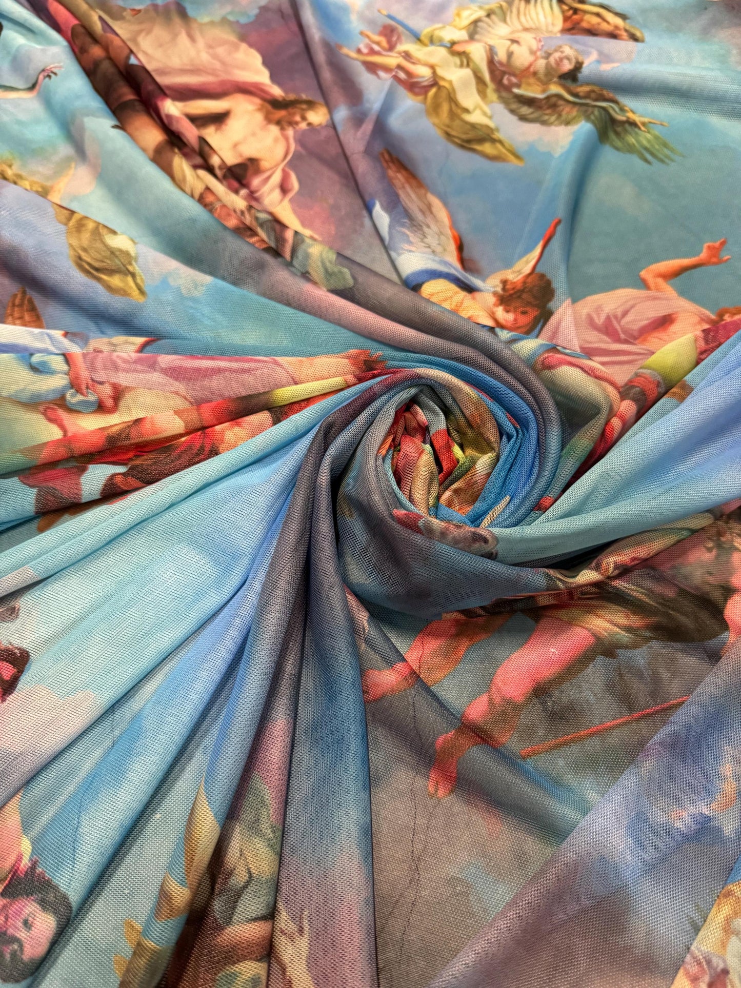 New angels and clouds design print on power mesh nylon spandex4-stretch 58/60”sold by the YD.Ships worldwide from Los Angeles California.