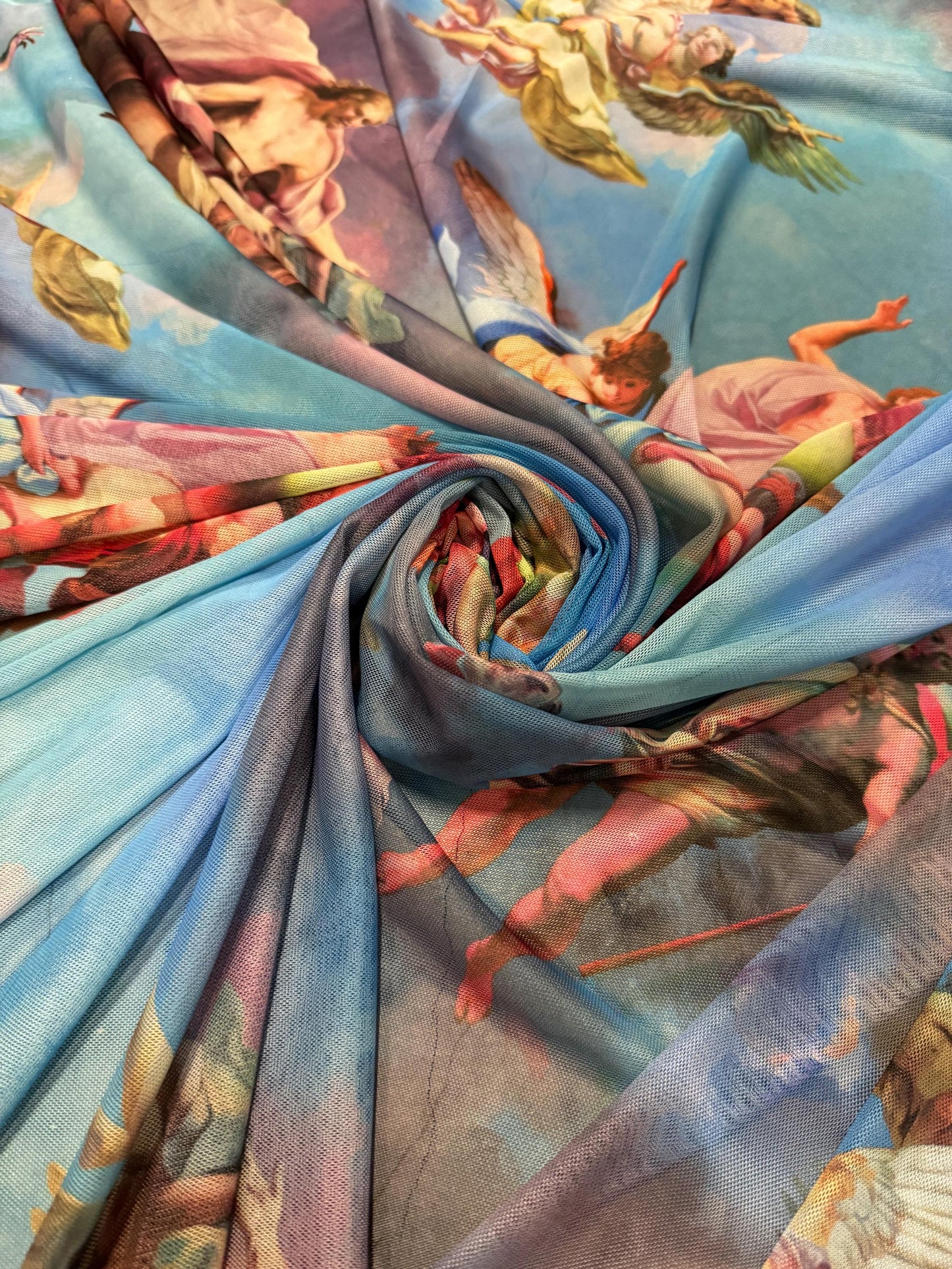 New angels and clouds design print on power mesh nylon spandex4-stretch 58/60”sold by the YD.Ships worldwide from Los Angeles California.