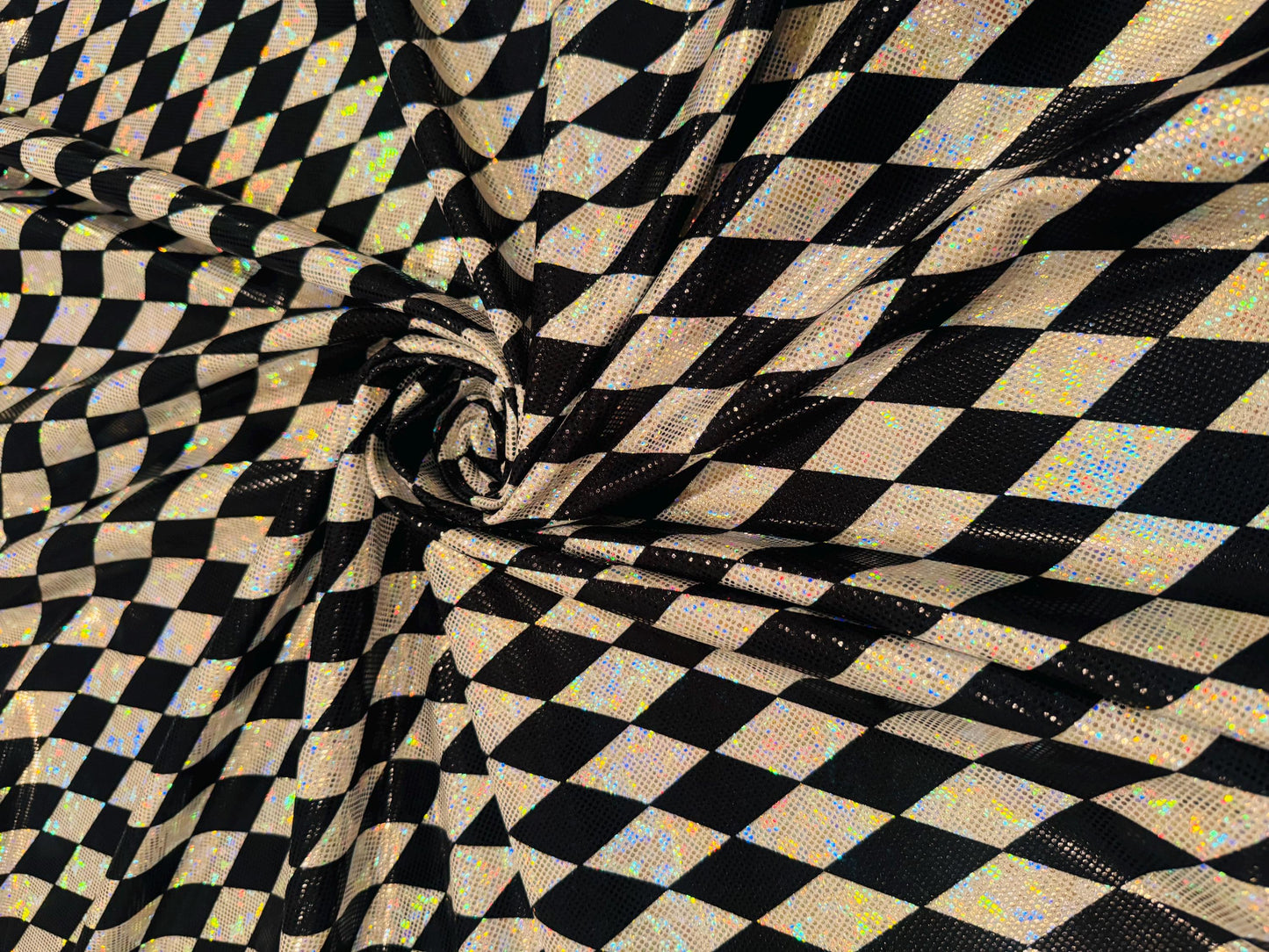 New Diamond Harlequin design print on shattered glass holograma metallic nylon spandex 4way stretch 58/60”Sold by the YD.from Los Angeles