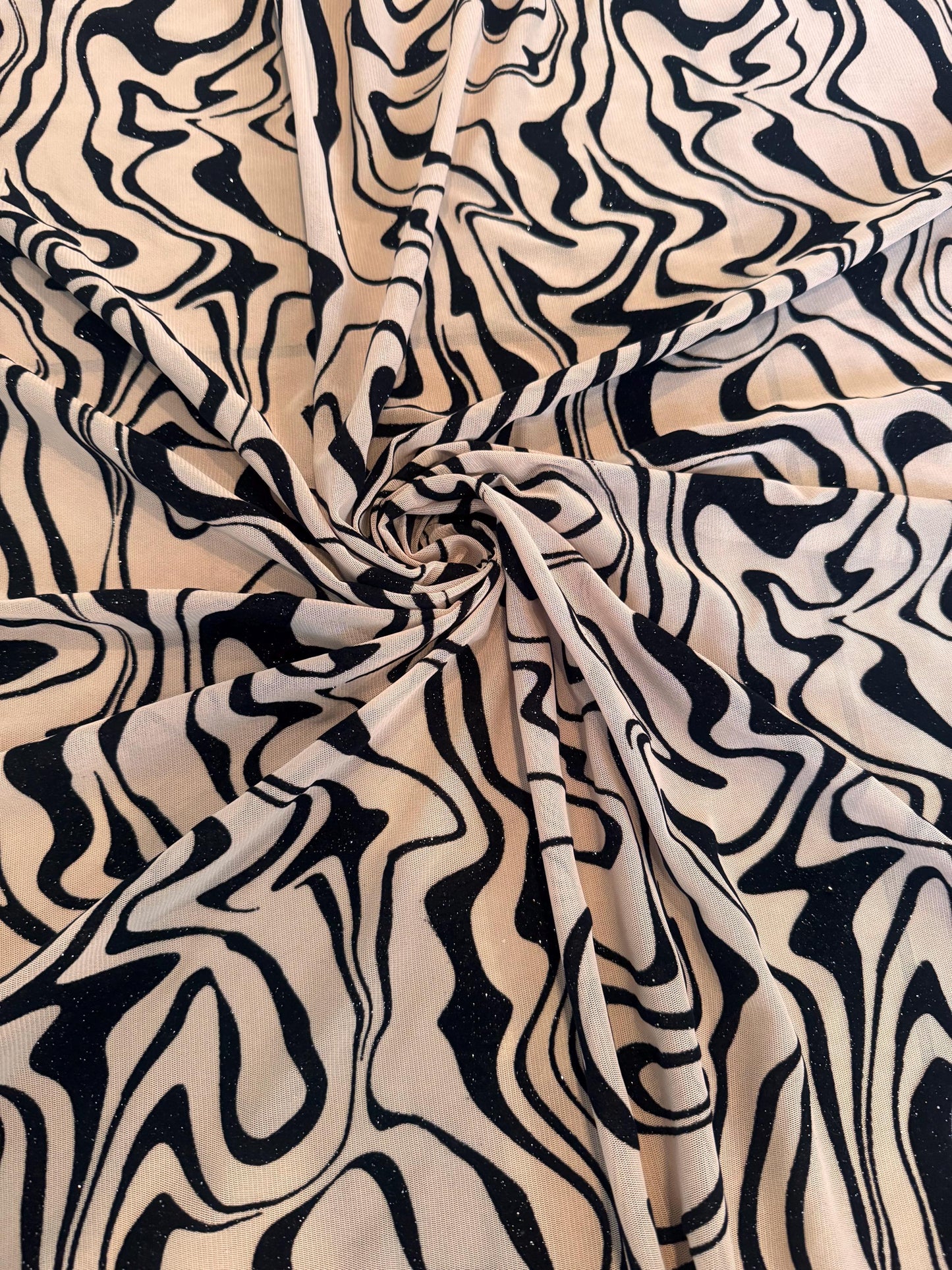 Modern abstract mesh with floking design nylon spandex 4-way stretch 58/60” sold by the YD.ships worldwide from Los Ángeles CA.