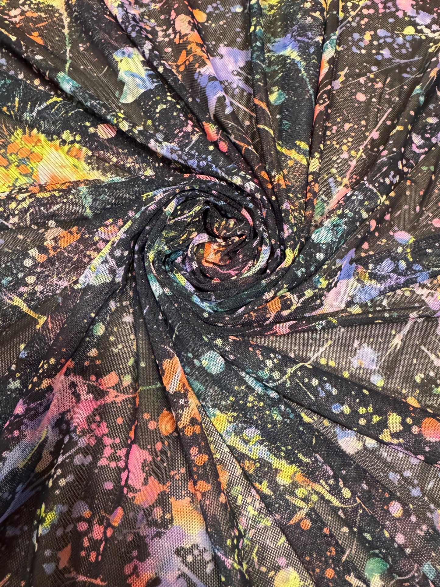 New colorful paint splatter design print on power mesh 4-way stretch 58/60” sold by the YD.ships worldwide from Los Ángeles California USA