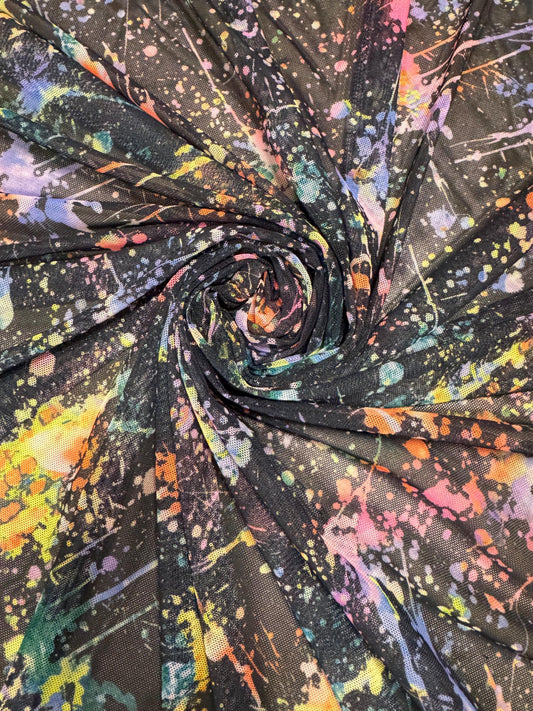 New colorful paint splatter design print on power mesh 4-way stretch 58/60” sold by the YD.ships worldwide from Los Ángeles California USA