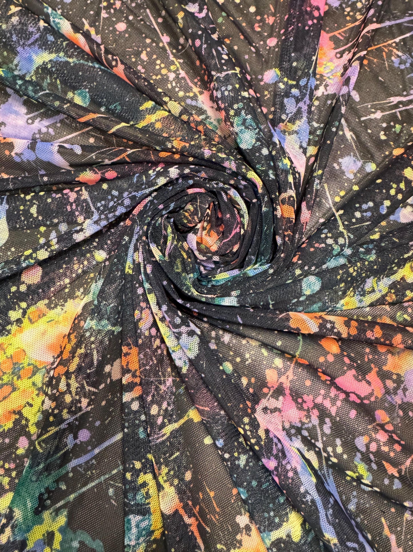 New colorful paint splatter design print on power mesh 4-way stretch 58/60” sold by the YD.ships worldwide from Los Ángeles California USA