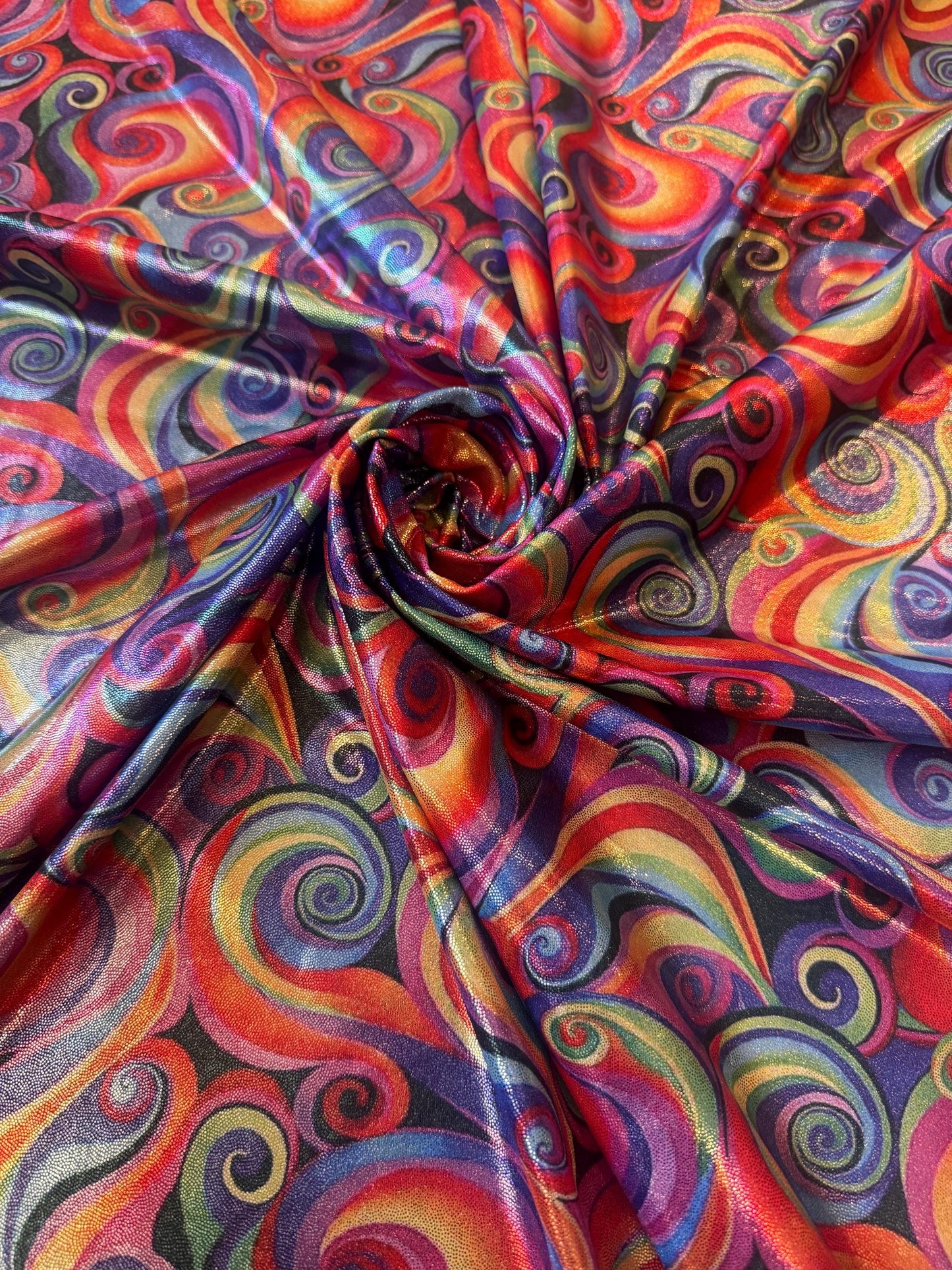 New Multicolor Swirl design print on metallic nylon spandex with foil 4-way stretch 58/60”Sold by the YD.Ships worldwide from LA.