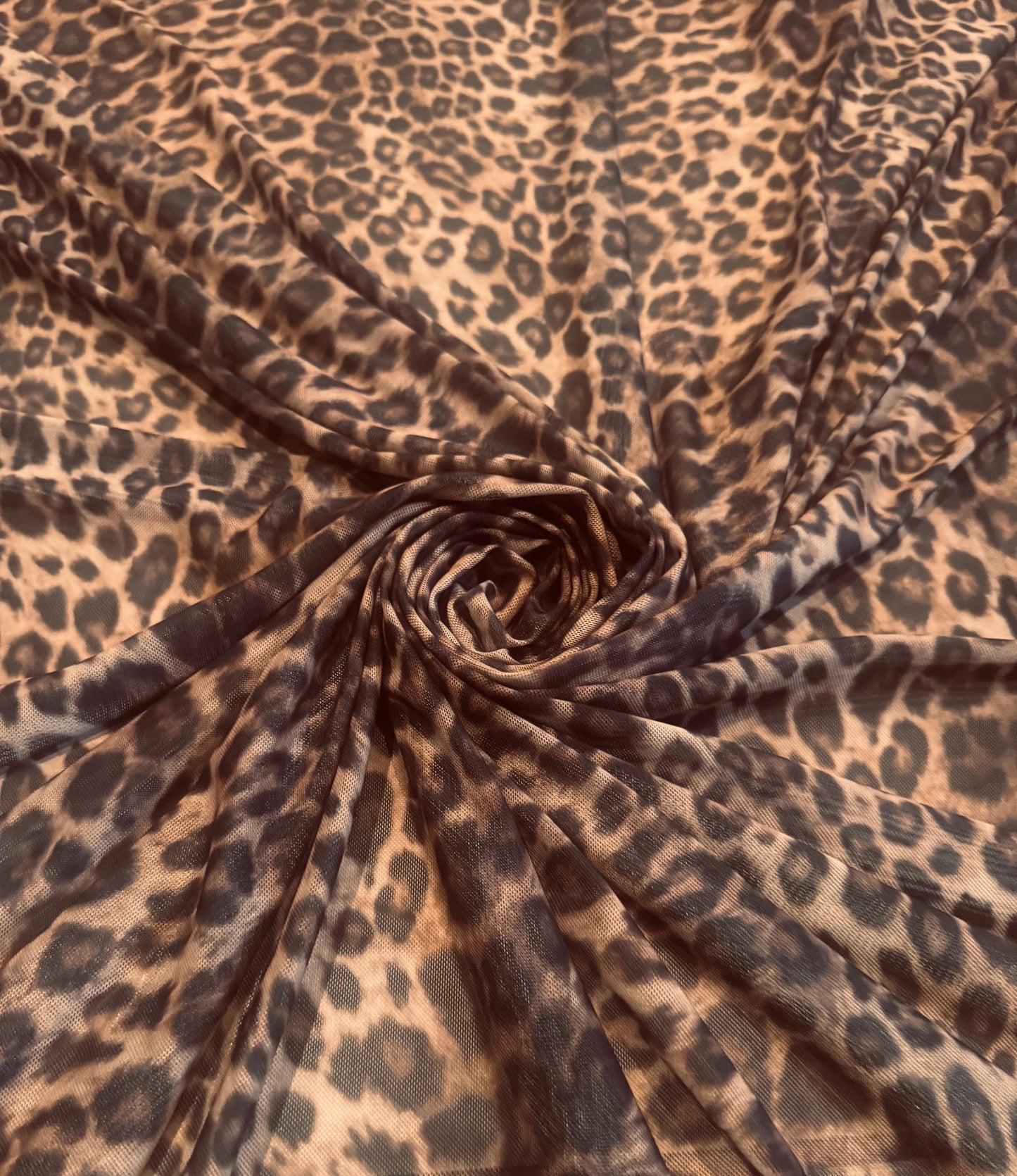 New cheetah animal design print on power mesh 4-way stretch 58/60”sold by the YD. Ships worldwide from Los Angeles California USA.
