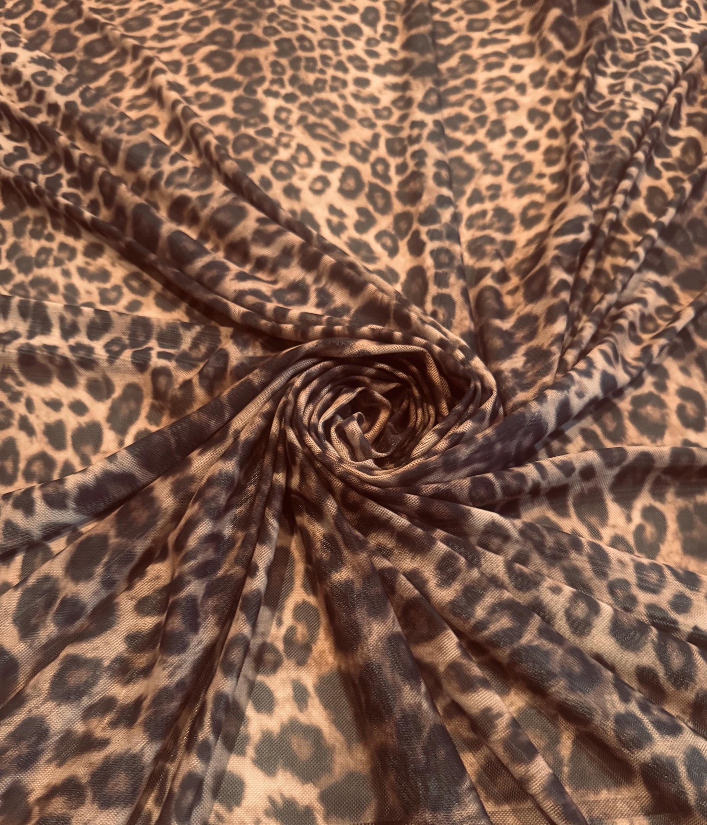 New cheetah animal design print on power mesh 4-way stretch 58/60”sold by the YD. Ships worldwide from Los Angeles California USA.