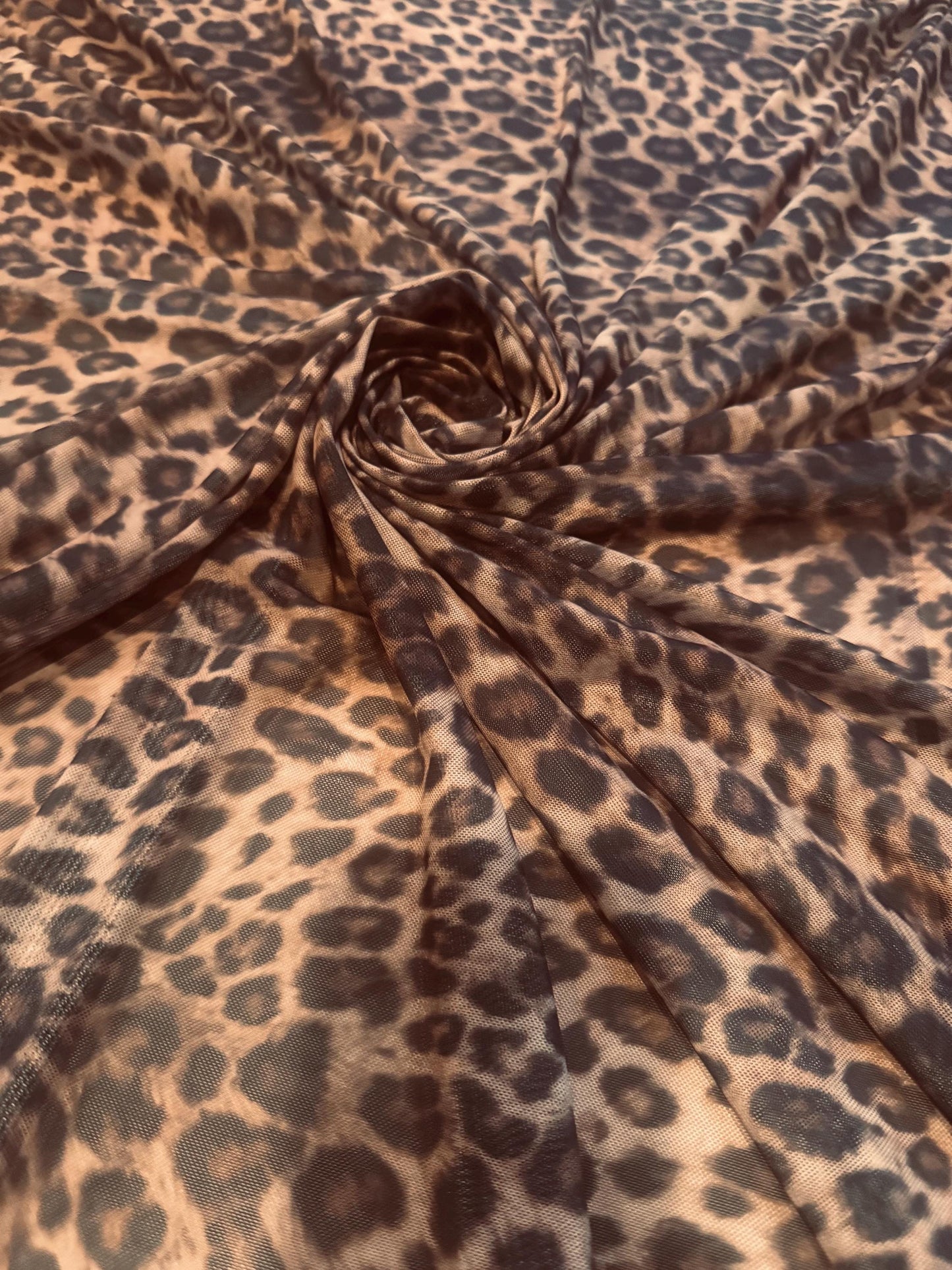 New cheetah animal design print on power mesh 4-way stretch 58/60”sold by the YD. Ships worldwide from Los Angeles California USA.