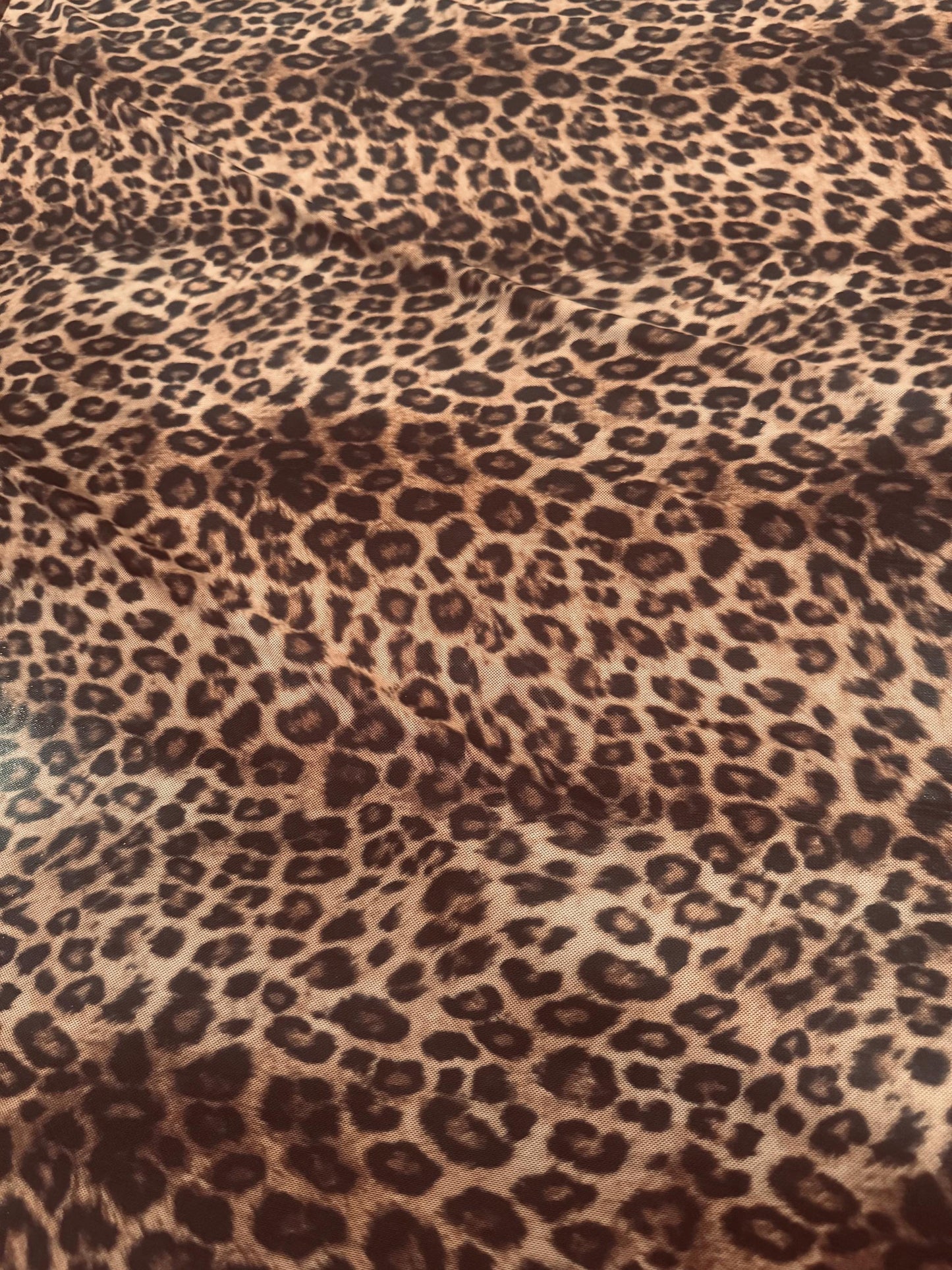 New cheetah animal design print on power mesh 4-way stretch 58/60”sold by the YD. Ships worldwide from Los Angeles California USA.