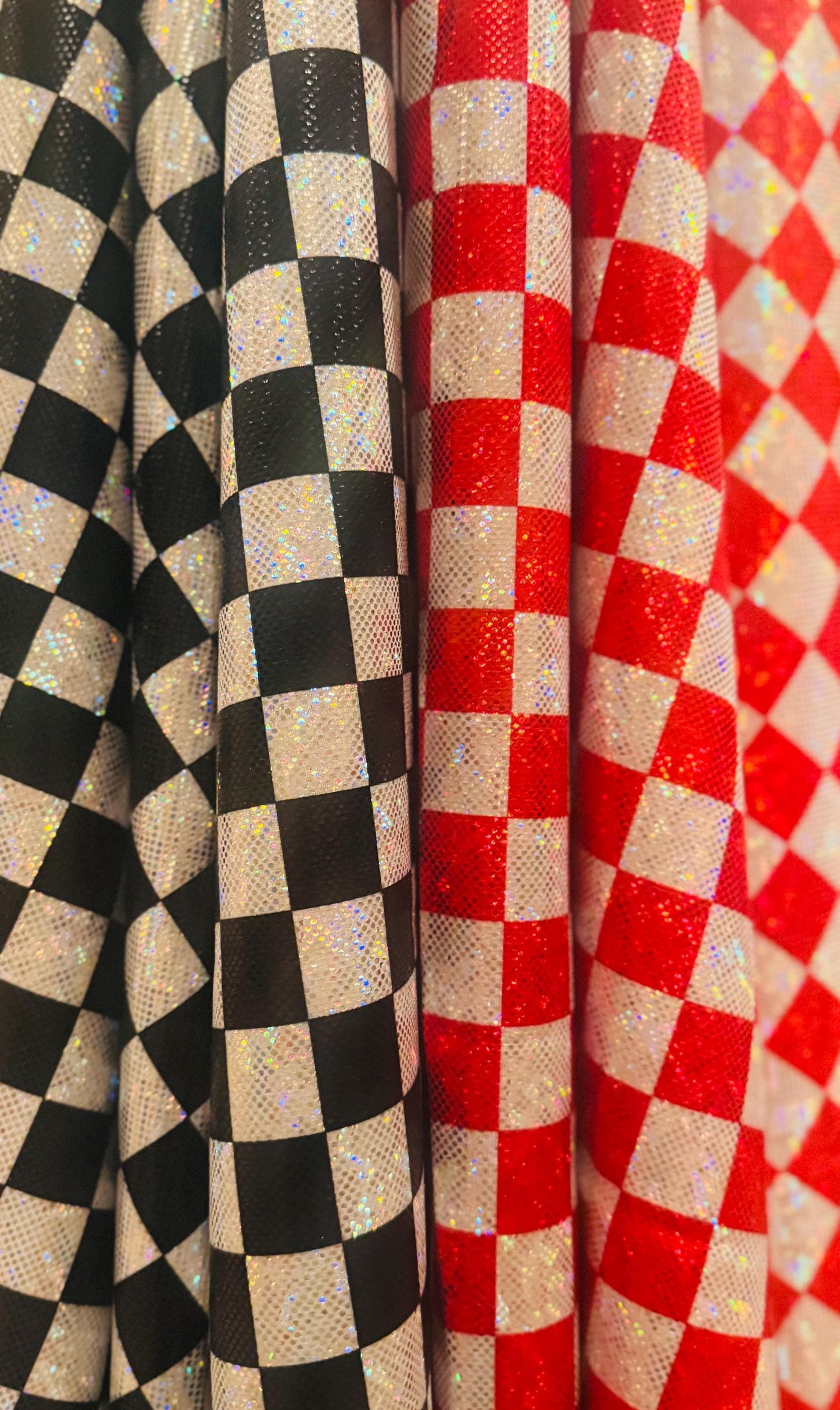 New Checkered pattern design 1”size print on shattered glass holograma metallic nylon spandex 4way stretch 58/60”Sold by the YD.
