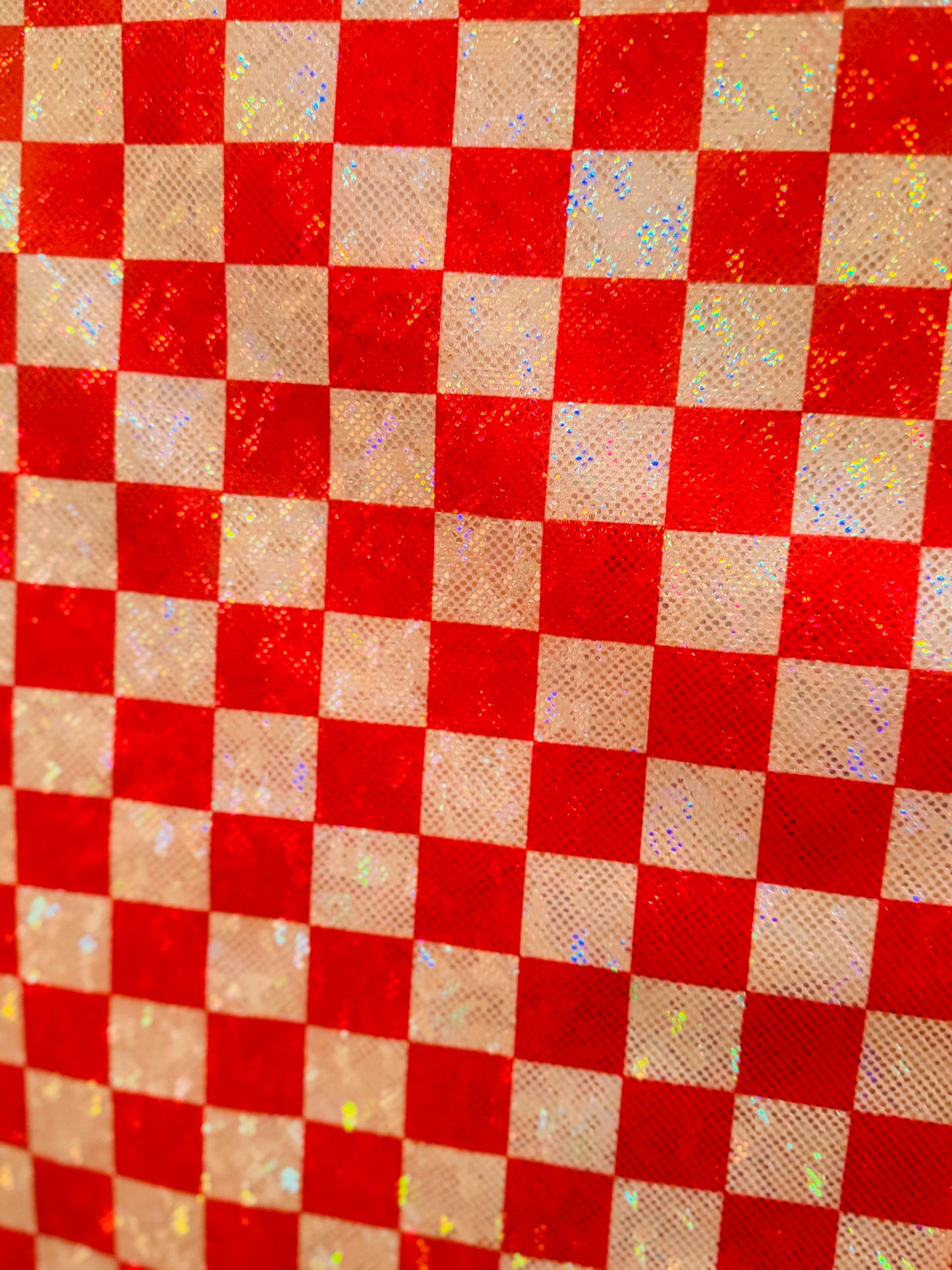 New Checkered pattern design 1”size print on shattered glass holograma metallic nylon spandex 4way stretch 58/60”Sold by the YD.