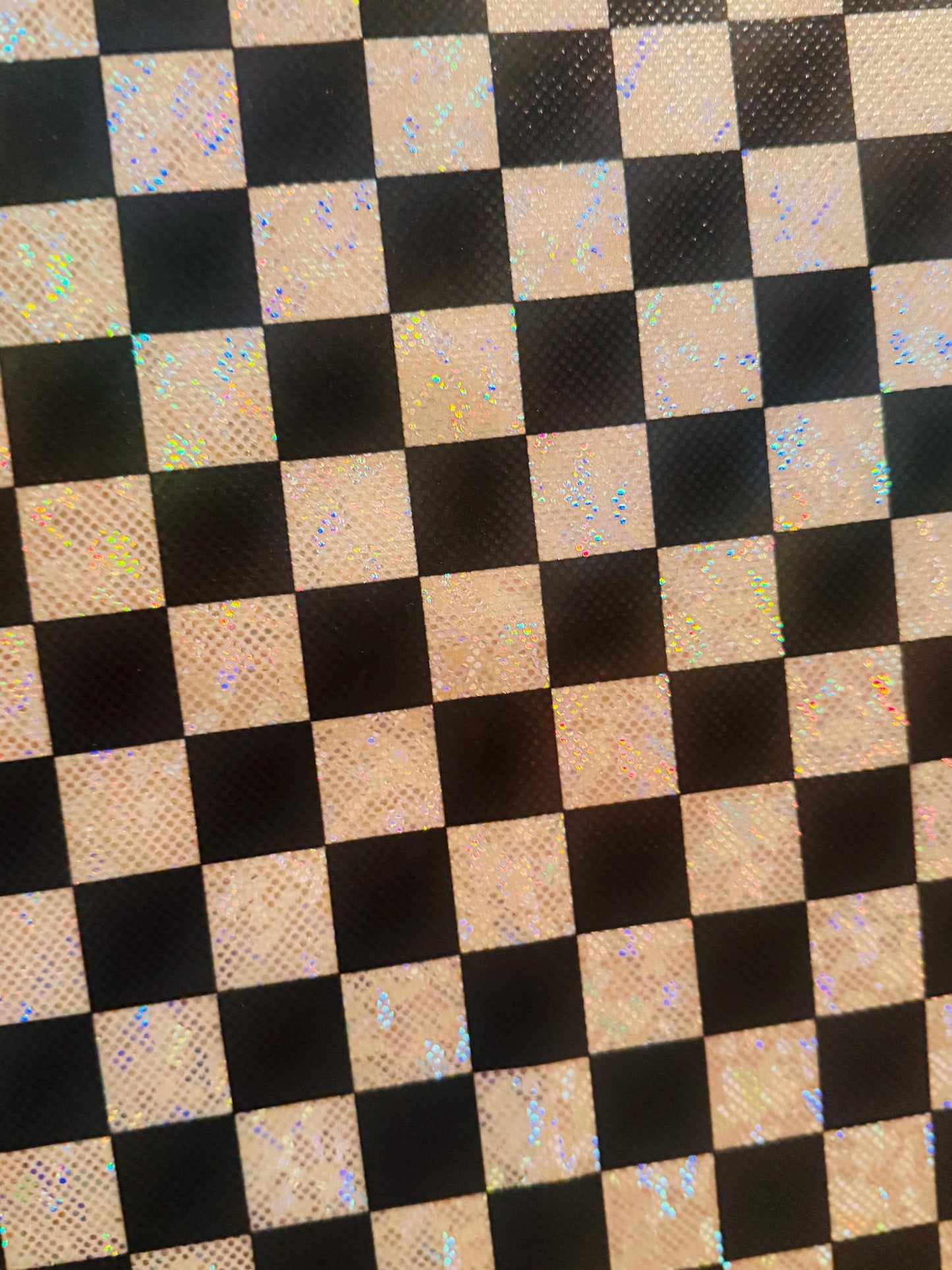 New Checkered pattern design 1”size print on shattered glass holograma metallic nylon spandex 4way stretch 58/60”Sold by the YD.
