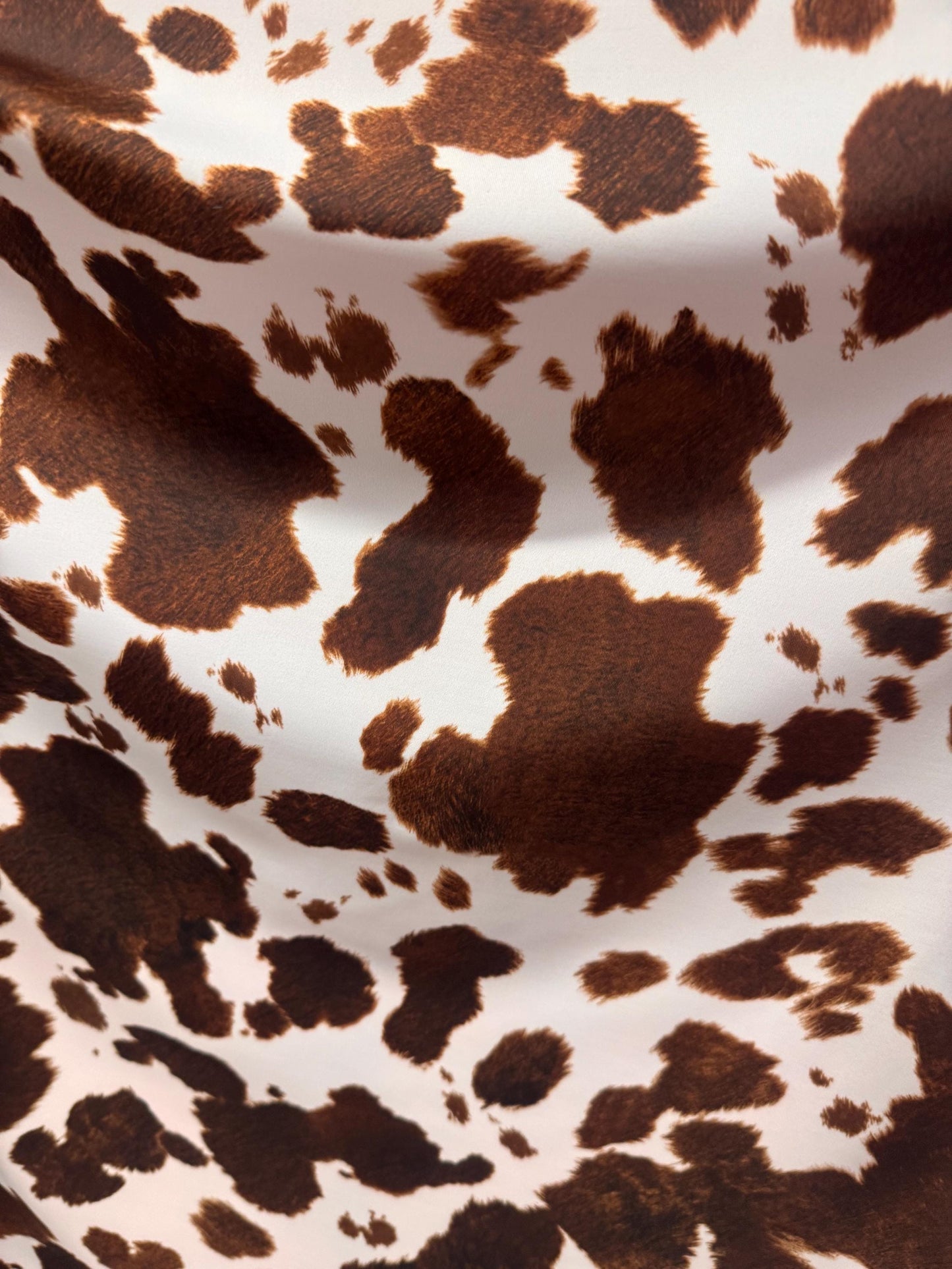 New Brown/White cow design print on best quality of nylon spandex 4-way stretch 58/60”sold by the YD. ships Worldwide from Los Angeles CA