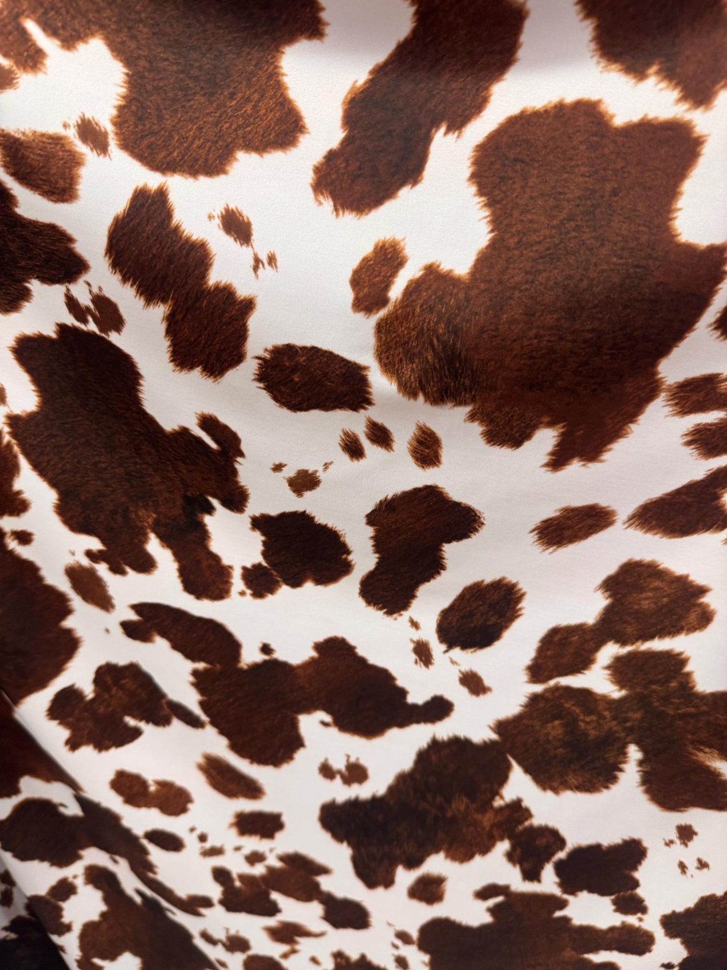 New Brown/White cow design print on best quality of nylon spandex 4-way stretch 58/60”sold by the YD. ships Worldwide from Los Angeles CA