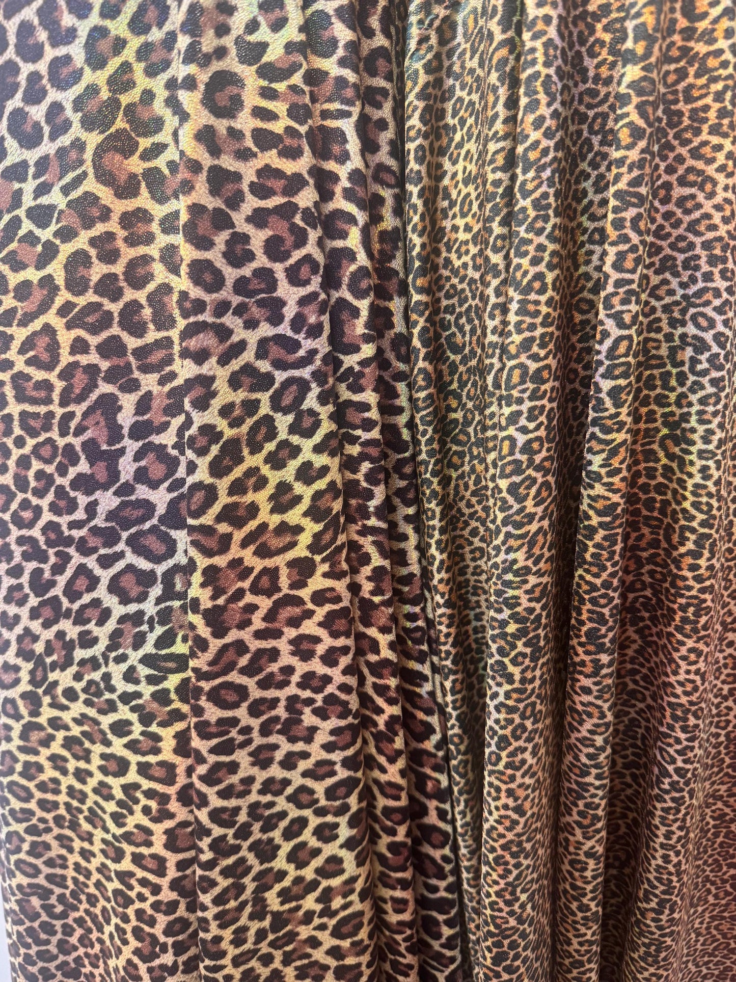 New Leopard skin design hologram metallic nylon spandex 4-way stretch 58/60”Sold by the YD.Ships worldwide from Los Angeles California USA.