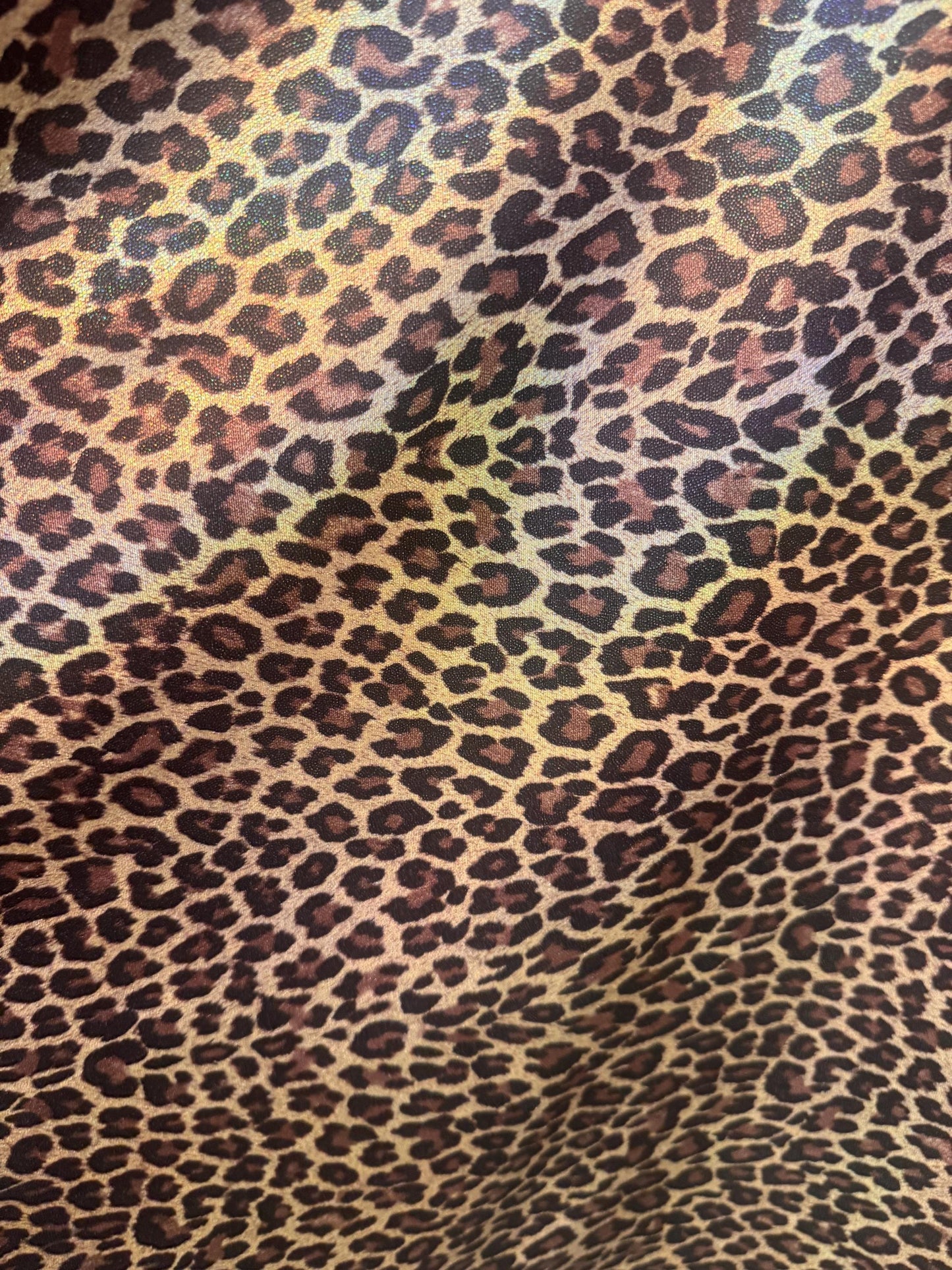 New Leopard skin design hologram metallic nylon spandex 4-way stretch 58/60”Sold by the YD.Ships worldwide from Los Angeles California USA.