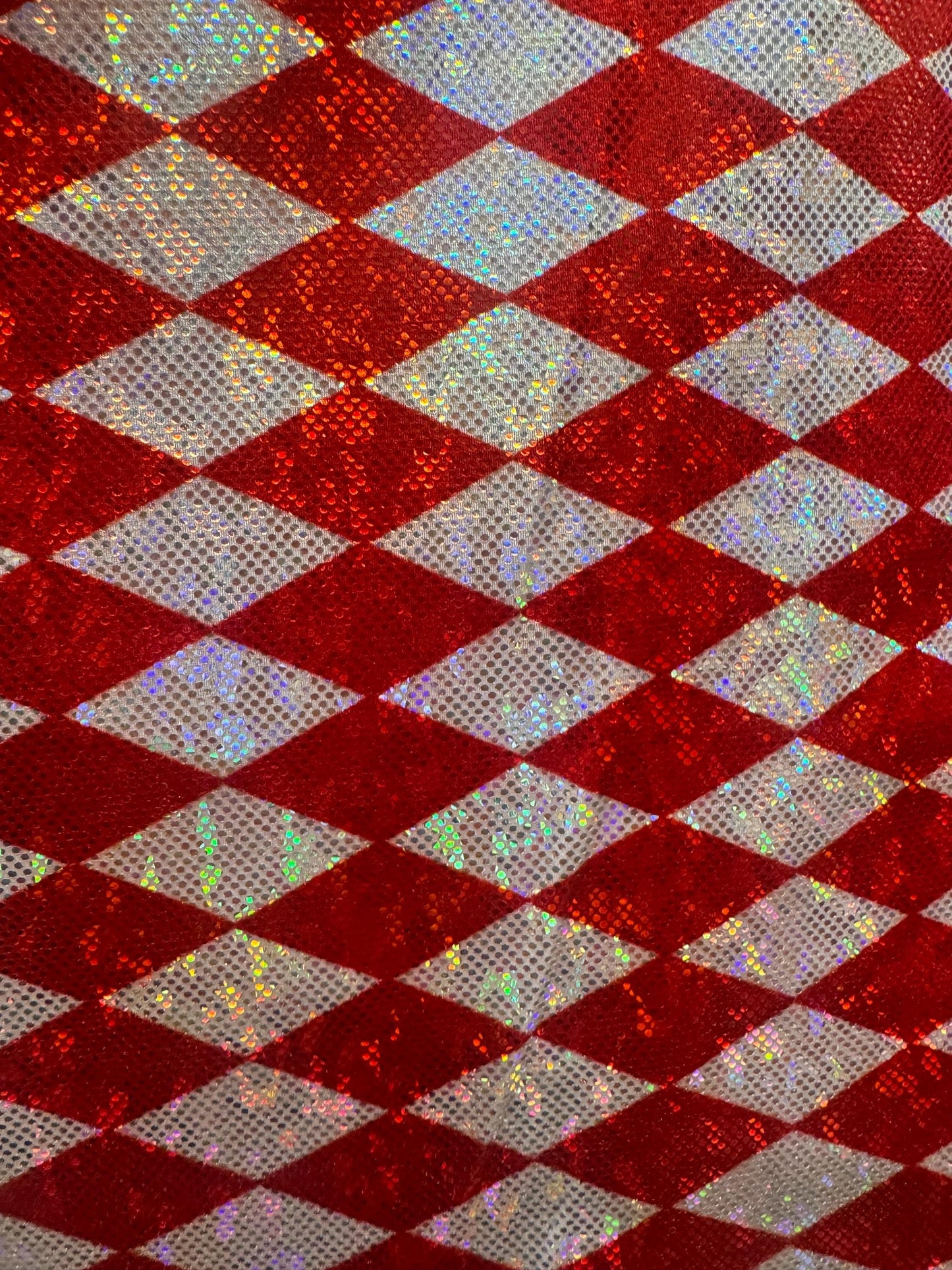 New Diamond Harlequin design print on shattered glass holograma metallic nylon spandex 4way stretch 58/60”Sold by the YD.from Los Angeles
