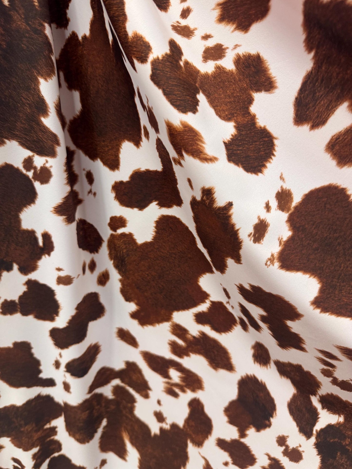 New Brown/White cow design print on best quality of nylon spandex 4-way stretch 58/60”sold by the YD. ships Worldwide from Los Angeles CA