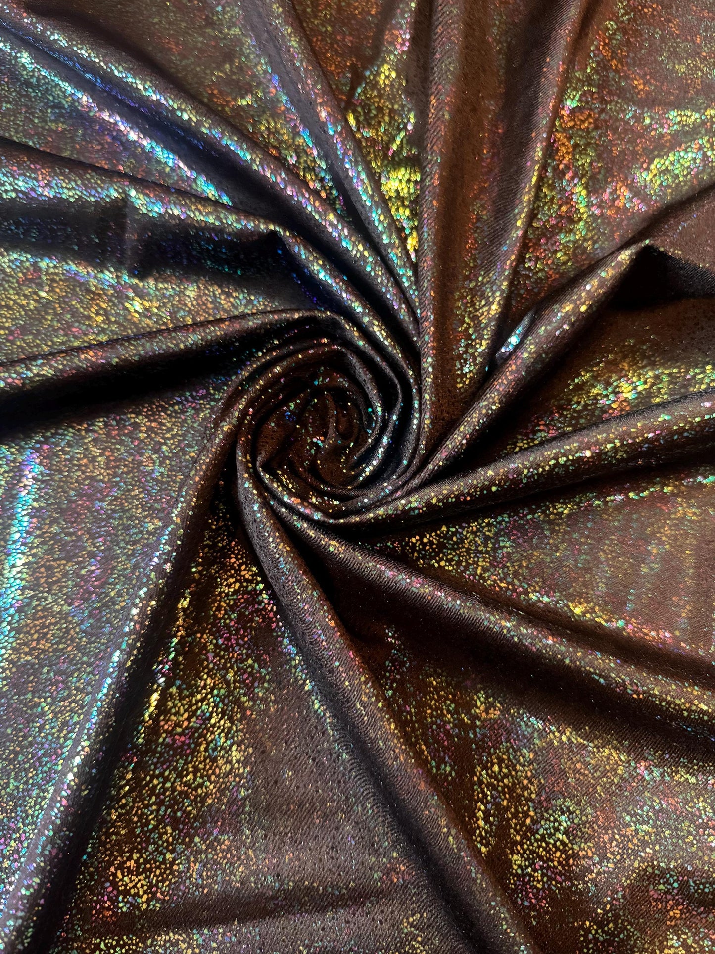 New Hologram Metallic pebbles design print on nylon spandex 4-way stretch 58/60”Sold by the YD.Ships worldwide from Los Angeles California