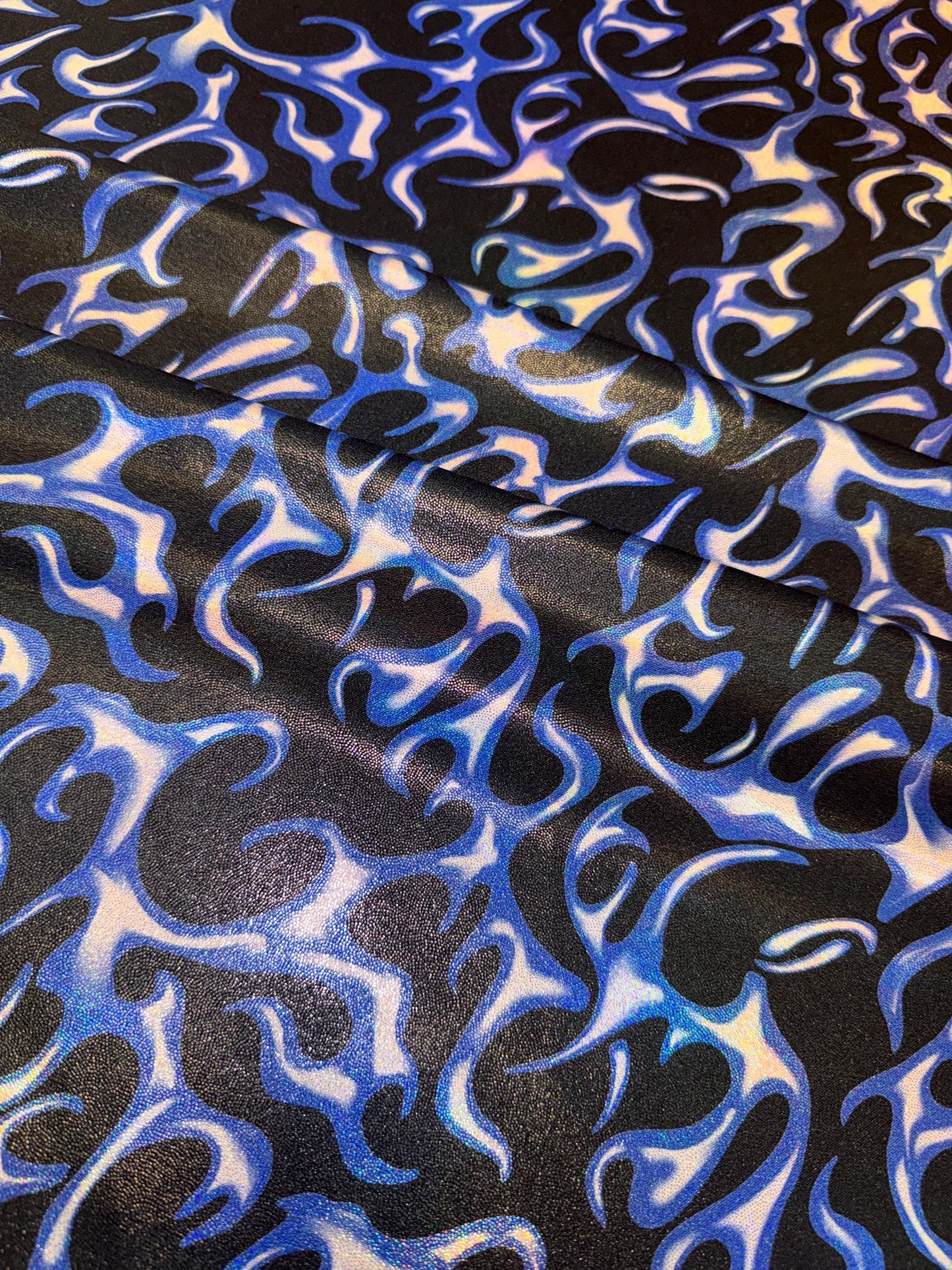 New Ghost Rider flames design print on metallic hologram nylon spandex 58/60”Sold by the YD.Ships worldwide from Los Angeles California