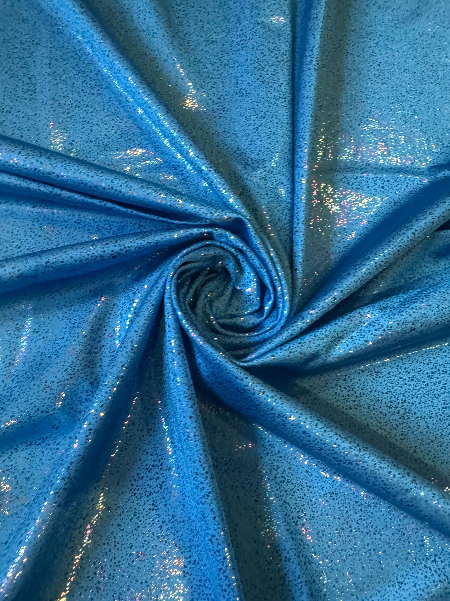 New Hologram Metallic pebbles design print on nylon spandex 4-way stretch 58/60”Sold by the YD.Ships worldwide from Los Angeles California