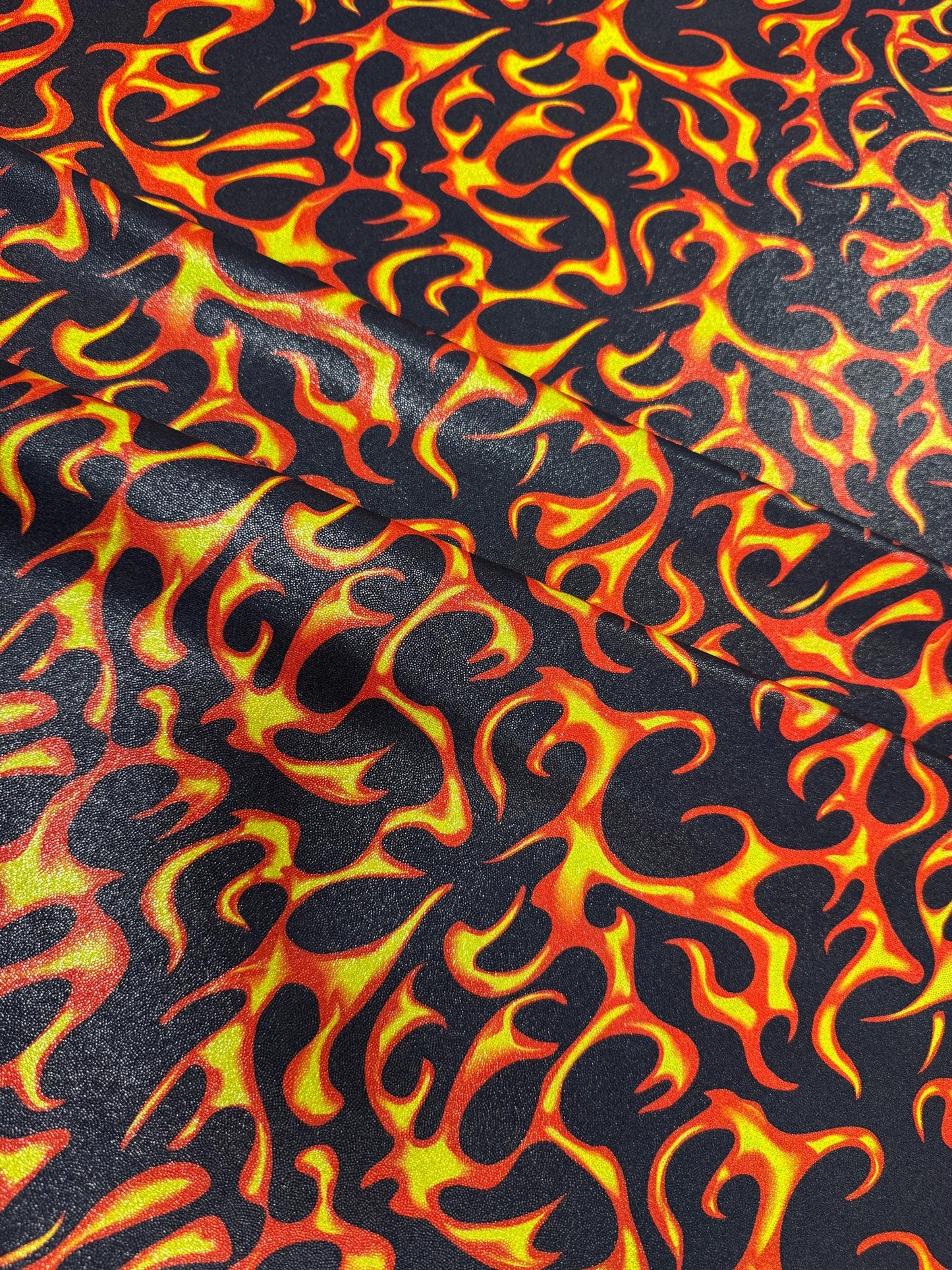 New Ghost Rider flames design print on metallic hologram nylon spandex 58/60”Sold by the YD.Ships worldwide from Los Angeles California