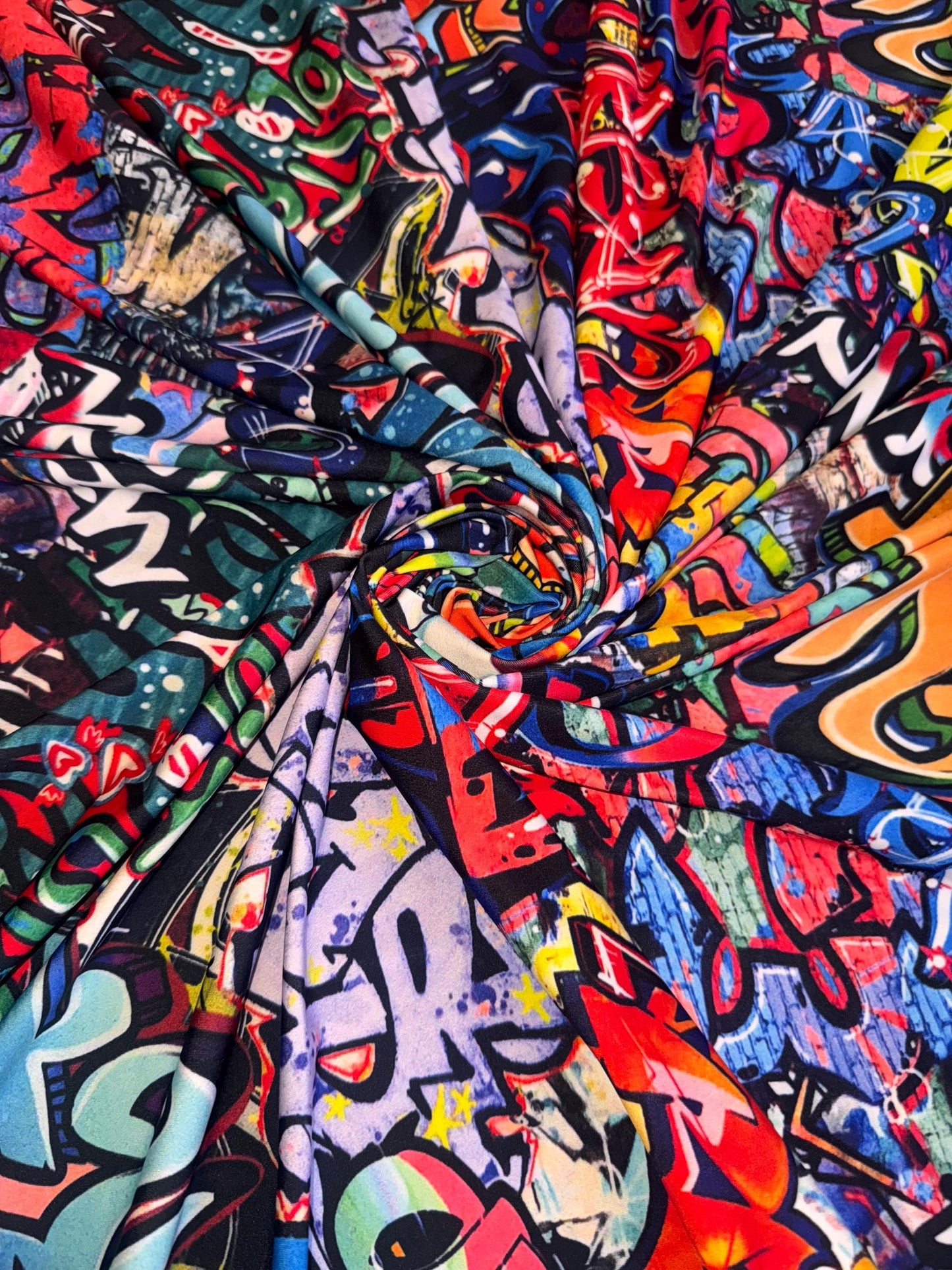 New streetstyle graffiti design print on nylon spandex 4-way stretch 58/60”sold by the YD.ships worldwide from Los Angeles California USA.