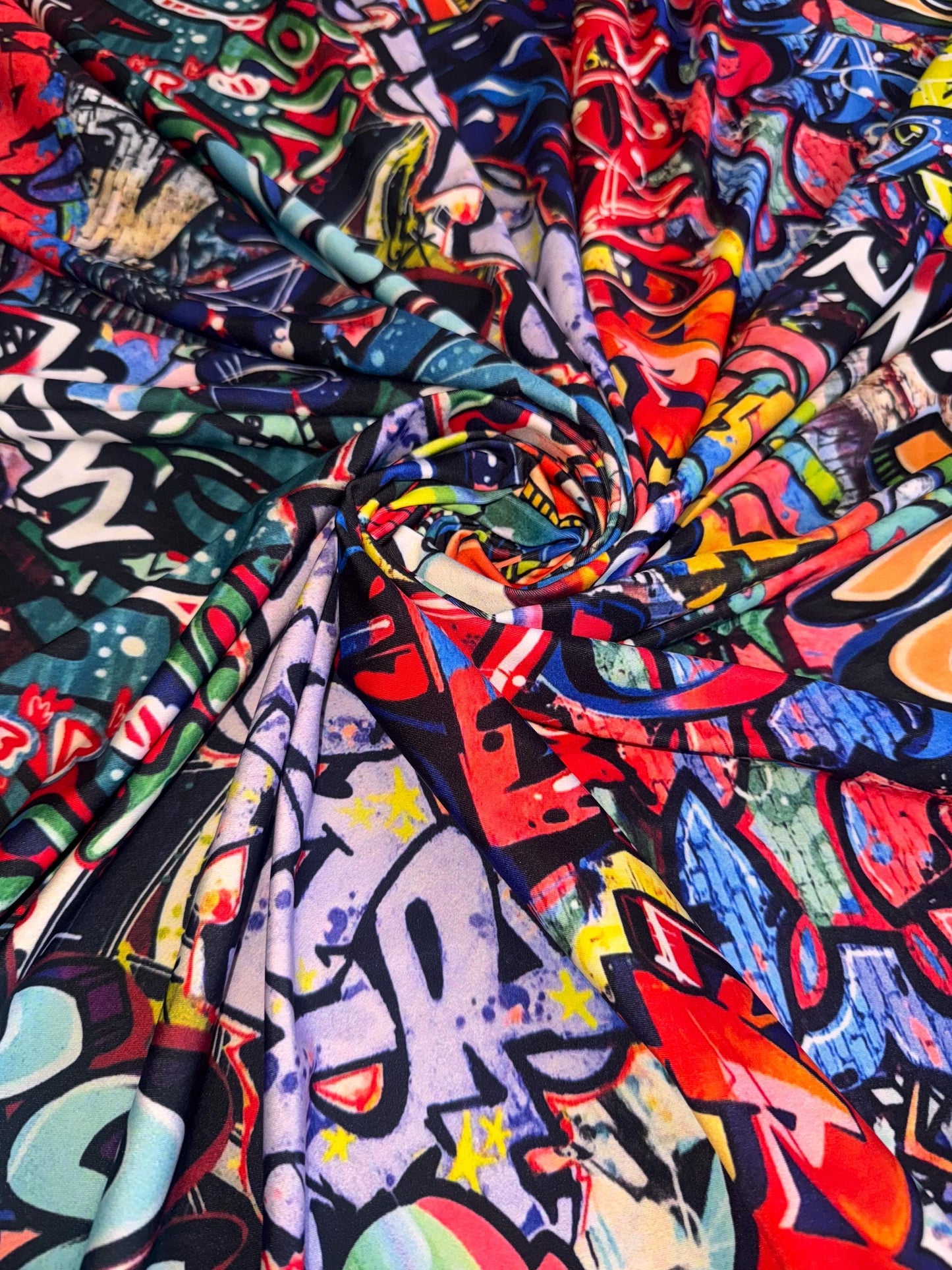 New streetstyle graffiti design print on nylon spandex 4-way stretch 58/60”sold by the YD.ships worldwide from Los Angeles California USA.