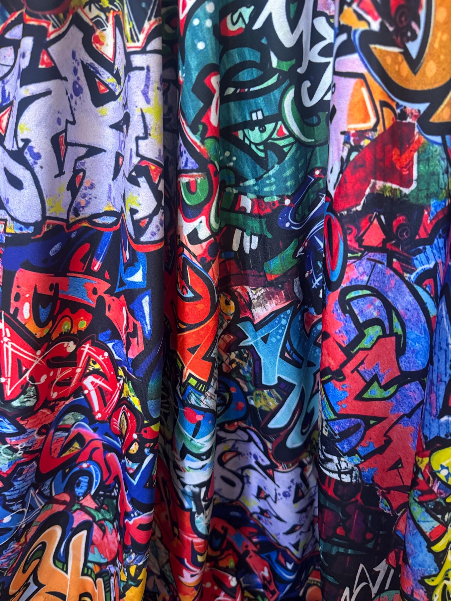 New streetstyle graffiti design print on nylon spandex 4-way stretch 58/60”sold by the YD.ships worldwide from Los Angeles California USA.