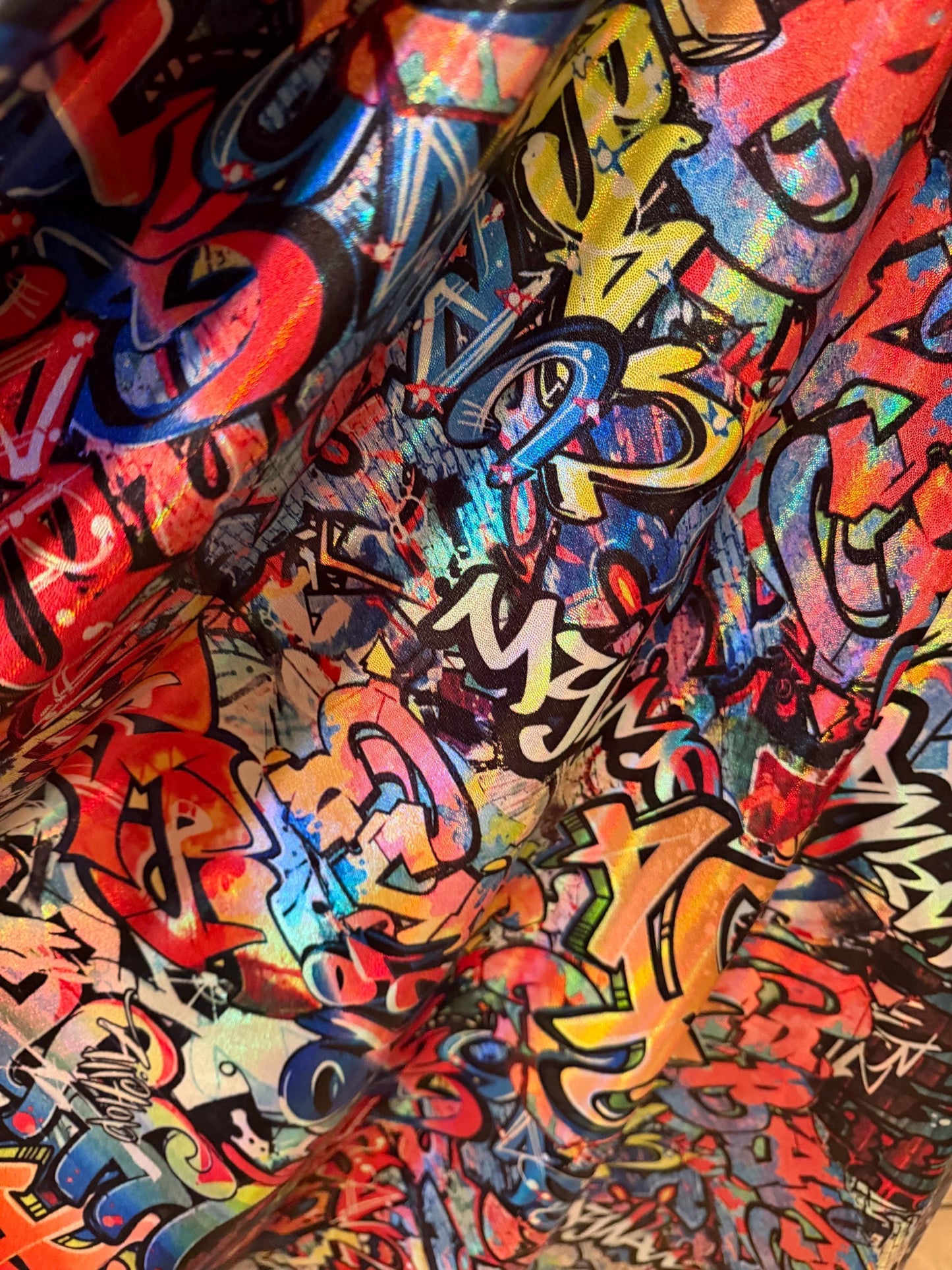 New Graffiti Art design  lacer hologram metallic nylon spandex 4-way stretch 58/60”sold by the YD.Ships worldwide from Los Angeles Ca.