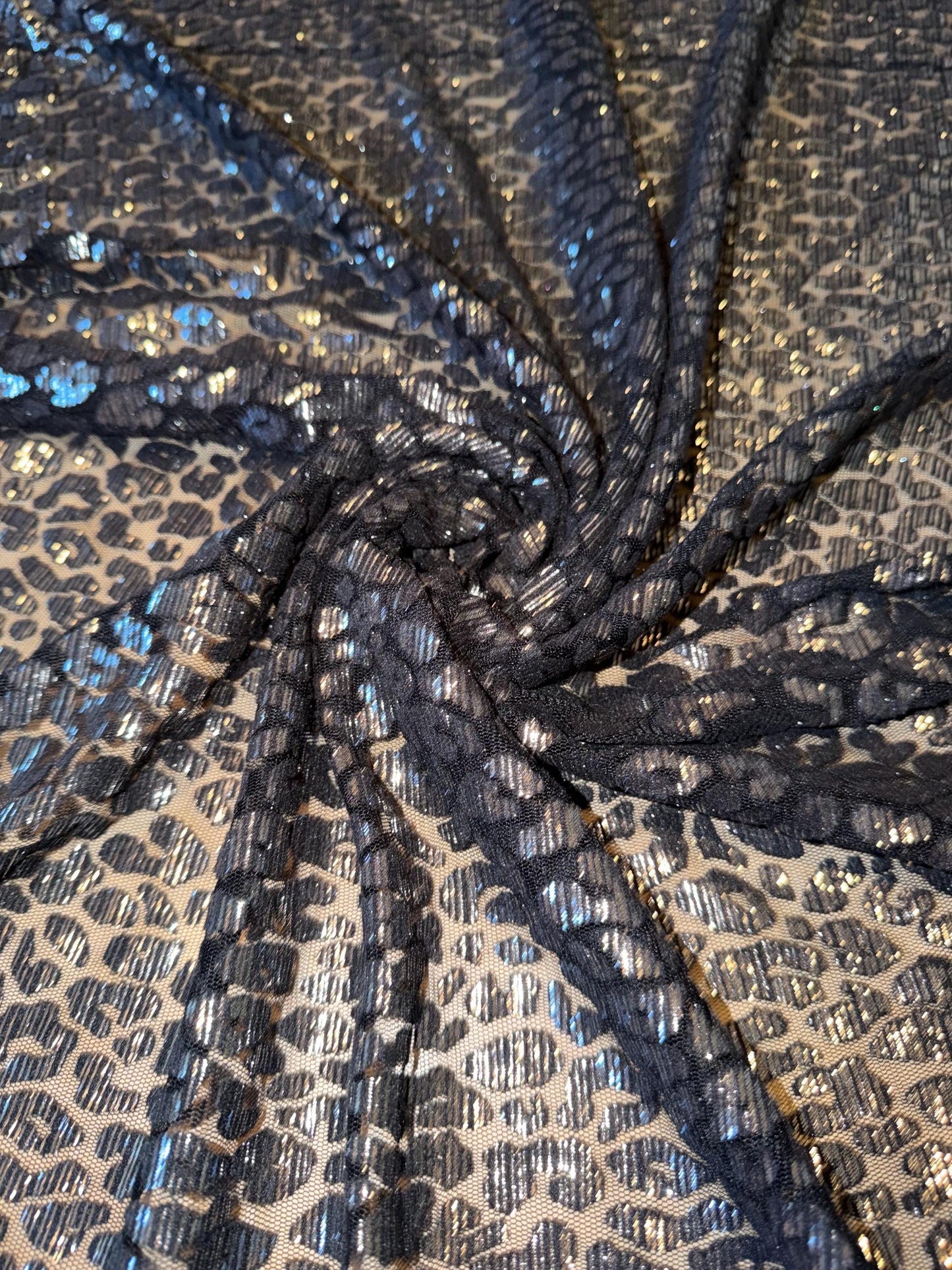 New cheetah pattern design on metallic mesh 2-way stretch 58/60”Sold by the YD.Ships worldwide from LA.