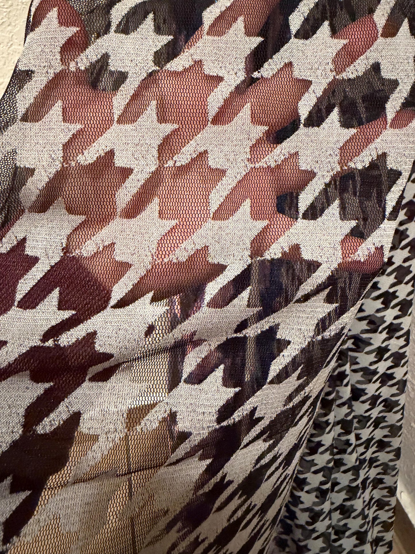 Houndstooth  design print on power mesh nylon spandex 4way stretch 58/60”sold by the YD. Ships worldwide from Los Angeles California USA.