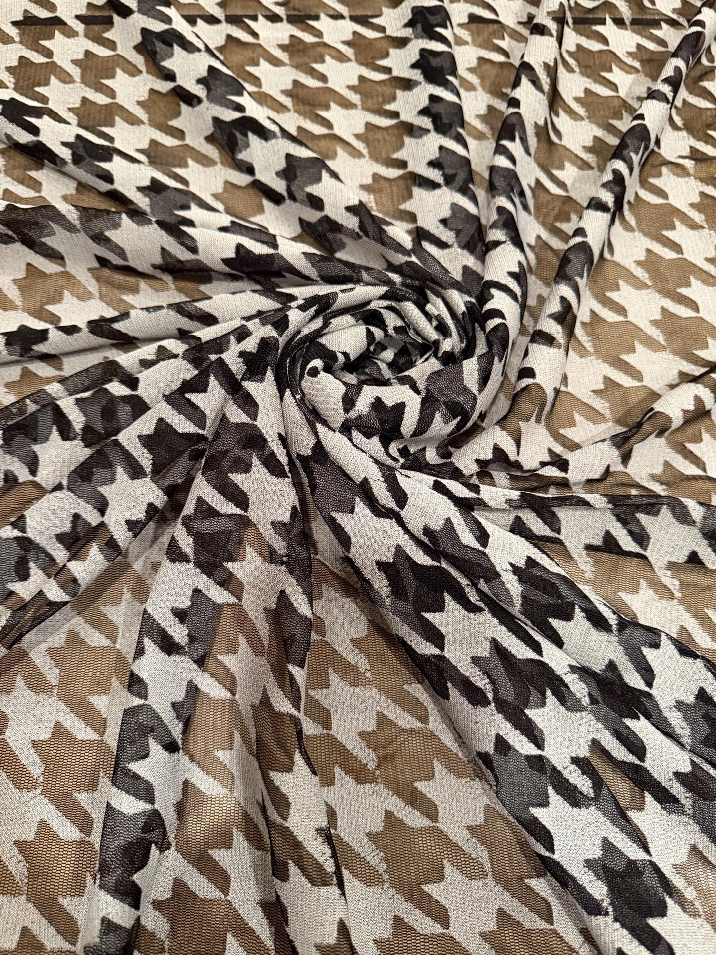 Houndstooth  design print on power mesh nylon spandex 4way stretch 58/60”sold by the YD. Ships worldwide from Los Angeles California USA.