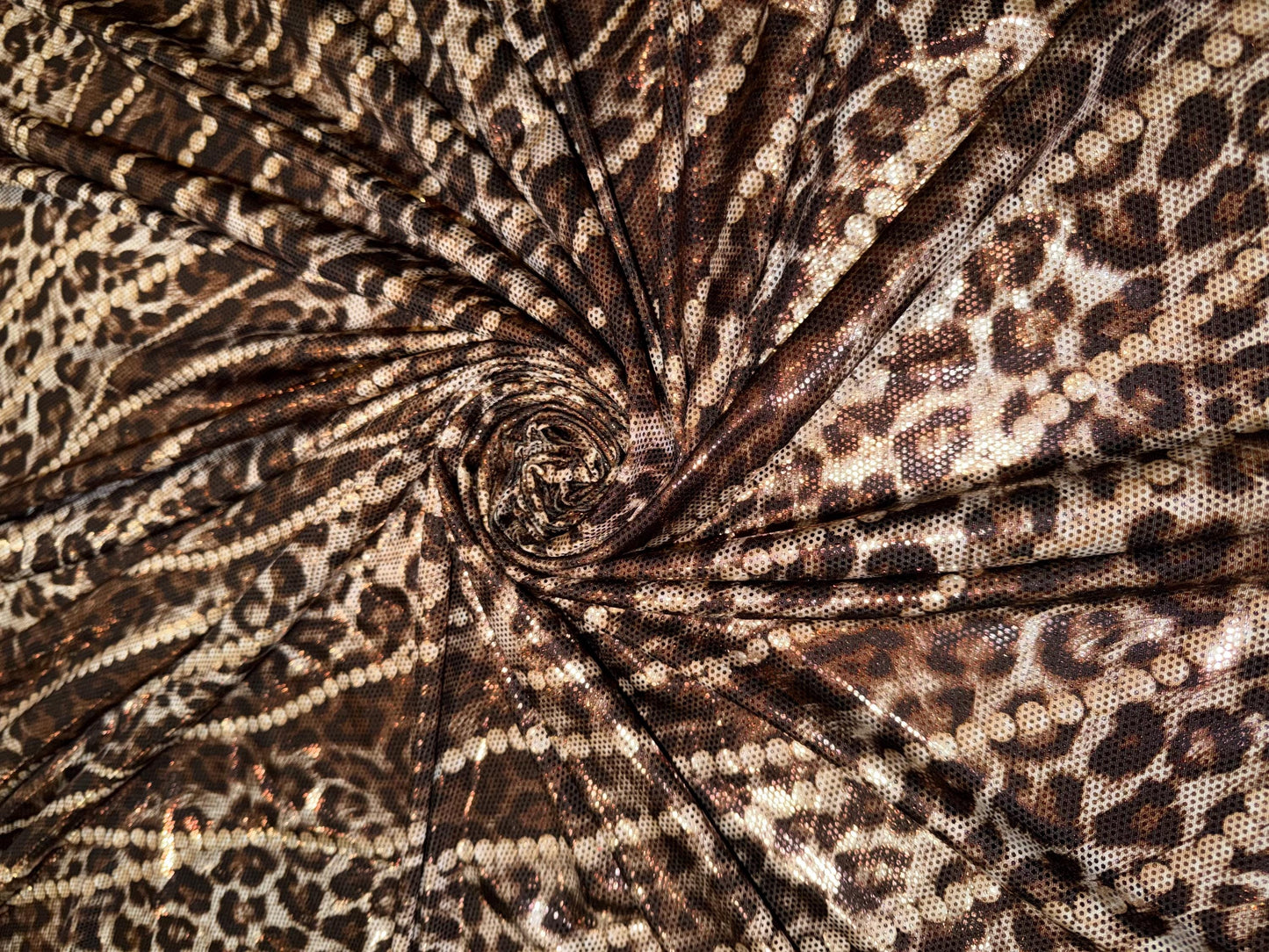 New Skin leopard and pearls design metallic poly spandex 4-way stretch 58/60”Sold by the YD.Ships worldwide from Los Angeles California USA.