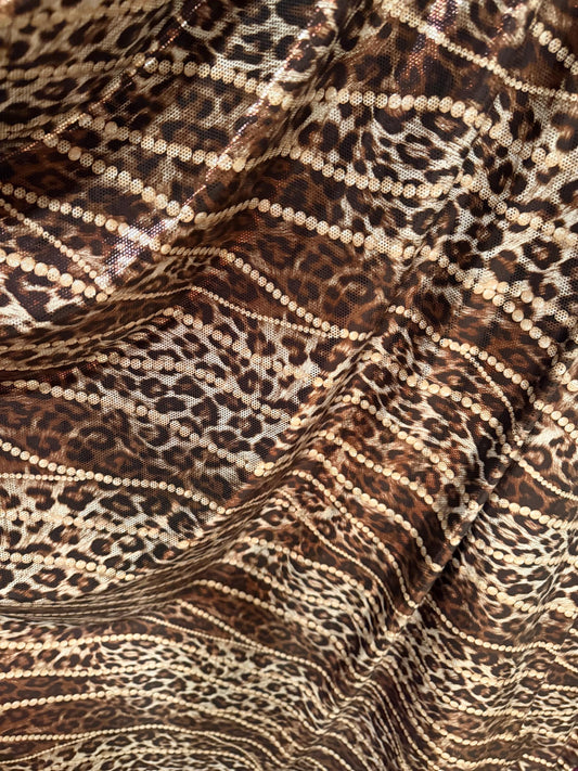 New Skin leopard and pearls design metallic poly spandex 4-way stretch 58/60”Sold by the YD.Ships worldwide from Los Angeles California USA.