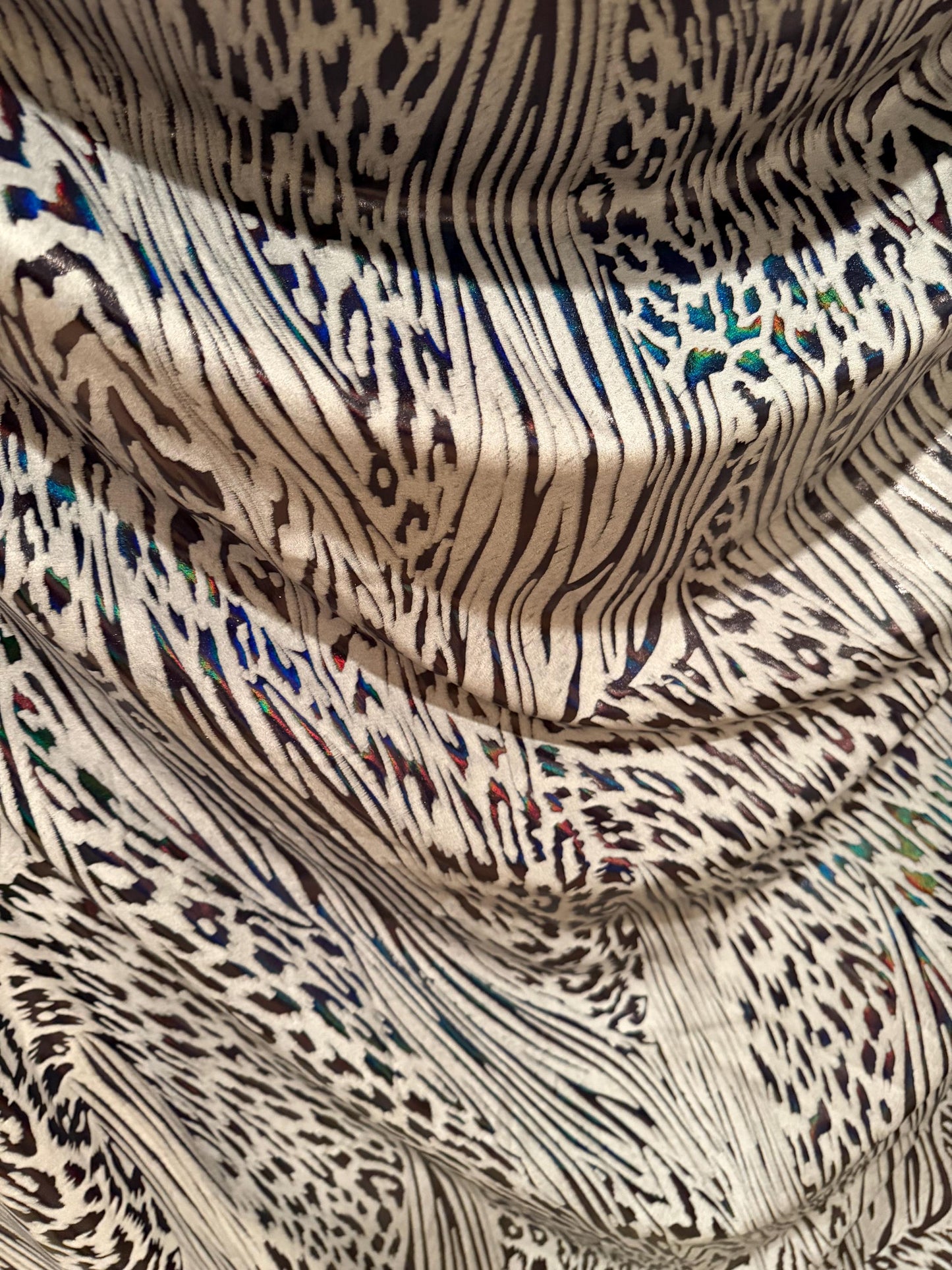 New abstract animal design on metallic hologram nylon spandex4-way stretch 58/60”sold by the YD. ships Worldwide from Los Angeles CA