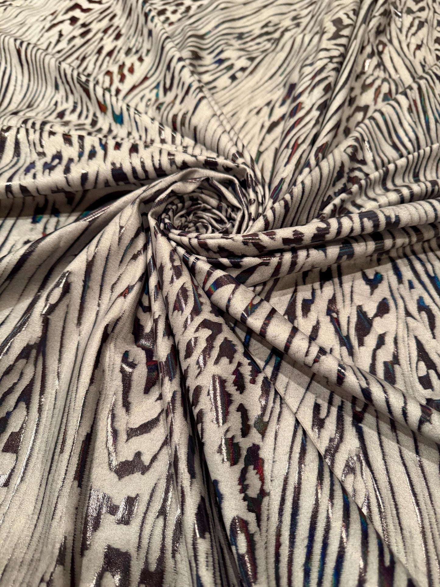 New abstract animal design on metallic hologram nylon spandex4-way stretch 58/60”sold by the YD. ships Worldwide from Los Angeles CA