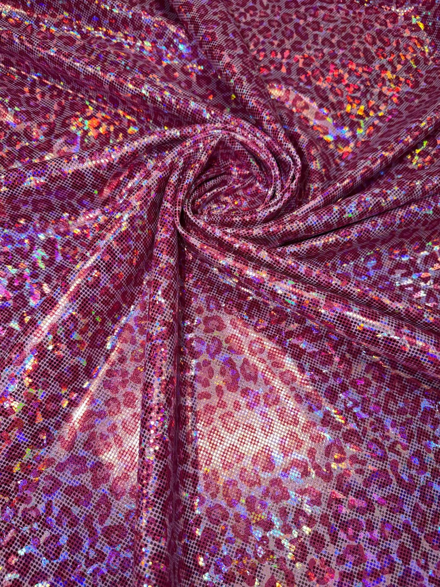 Modern cheetah design print on nylon spandex hologram metallic 4-way stretch 58/60”Sold by the YD.Ships worldwide from Los Angeles CA.